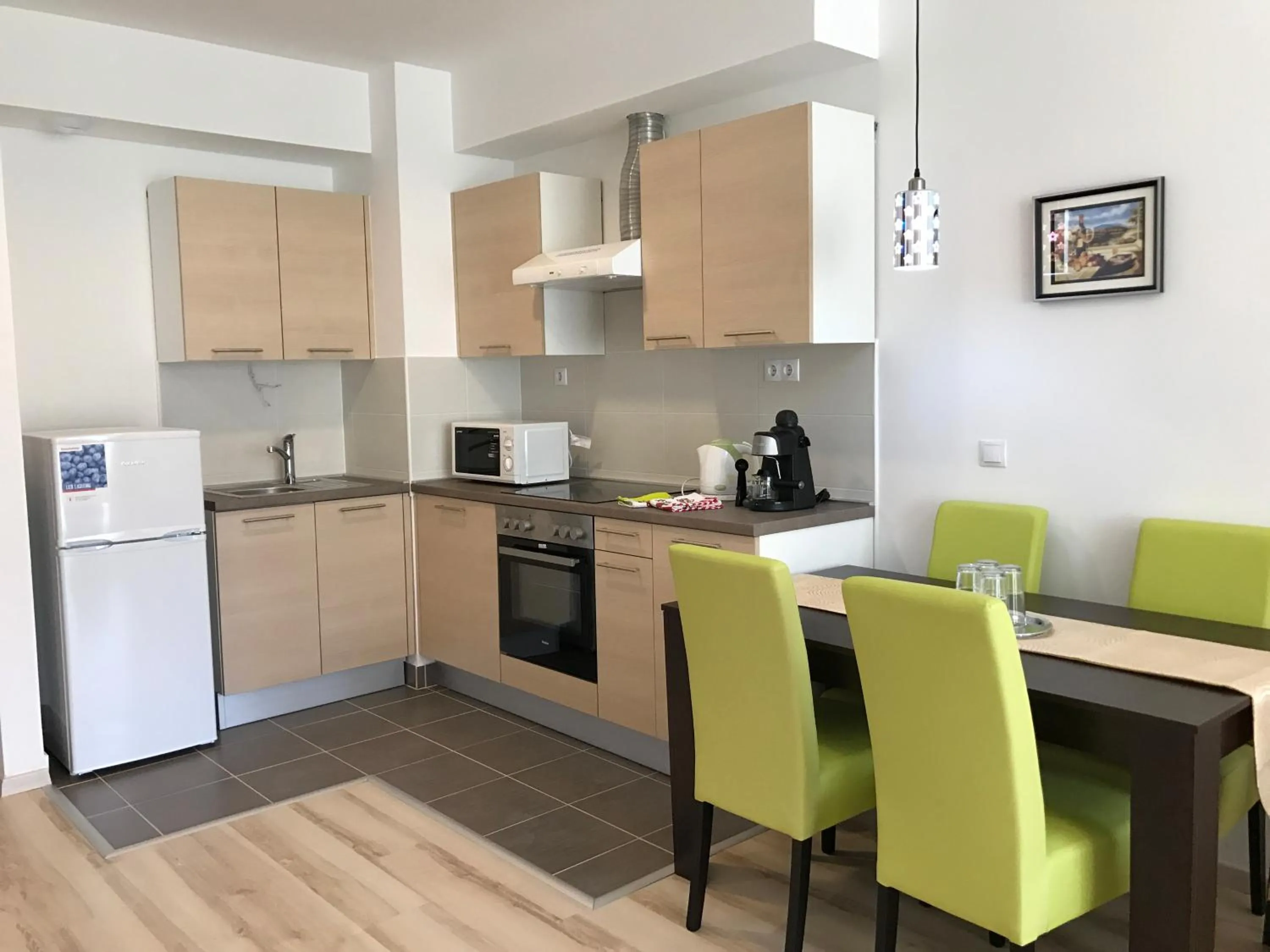 Kitchen or kitchenette in Corvin Rose Apartment Hotel