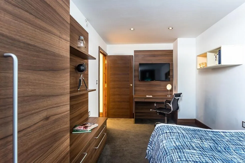 Bed in Livin' Serviced Apartments