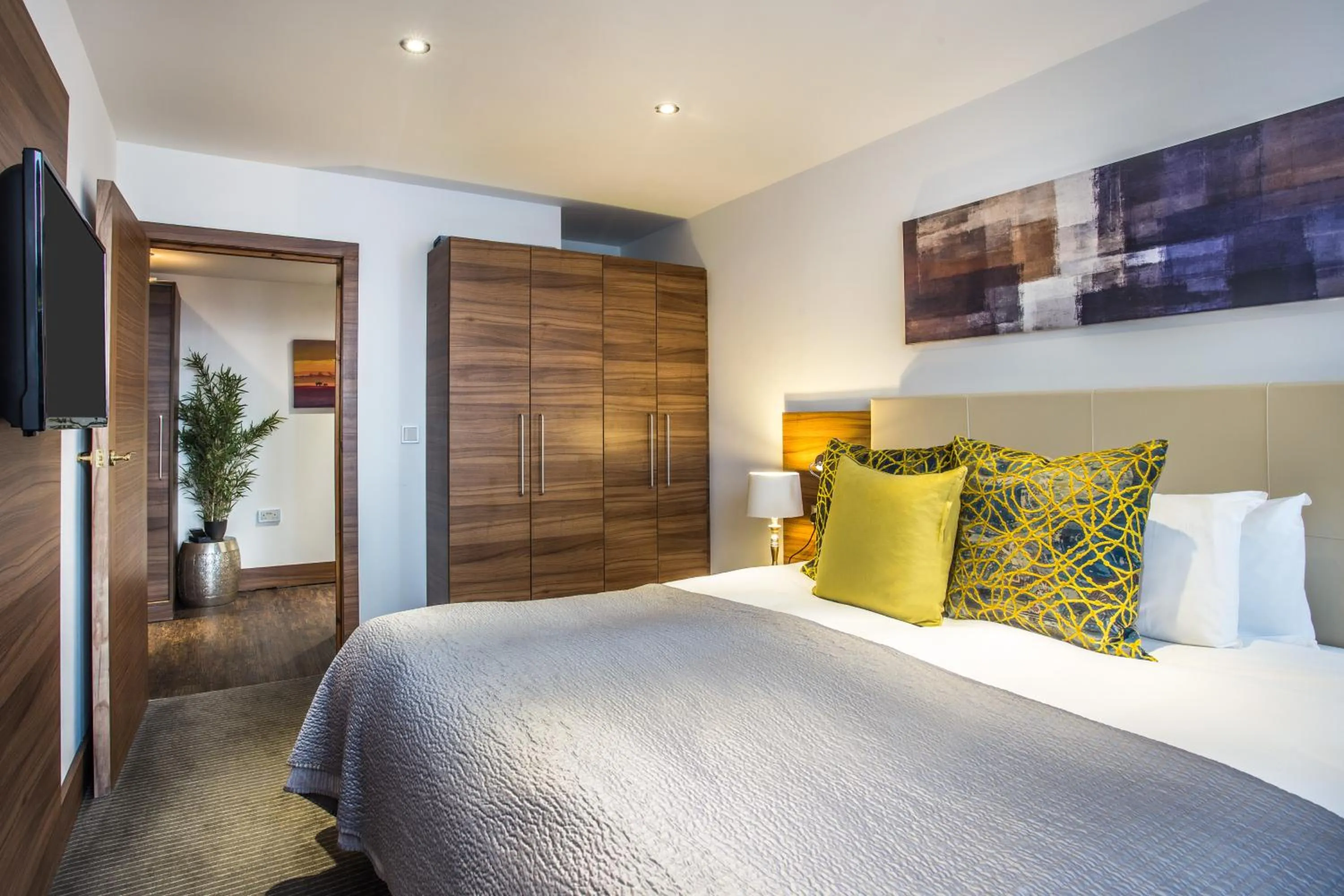 Bed in Livin' Serviced Apartments