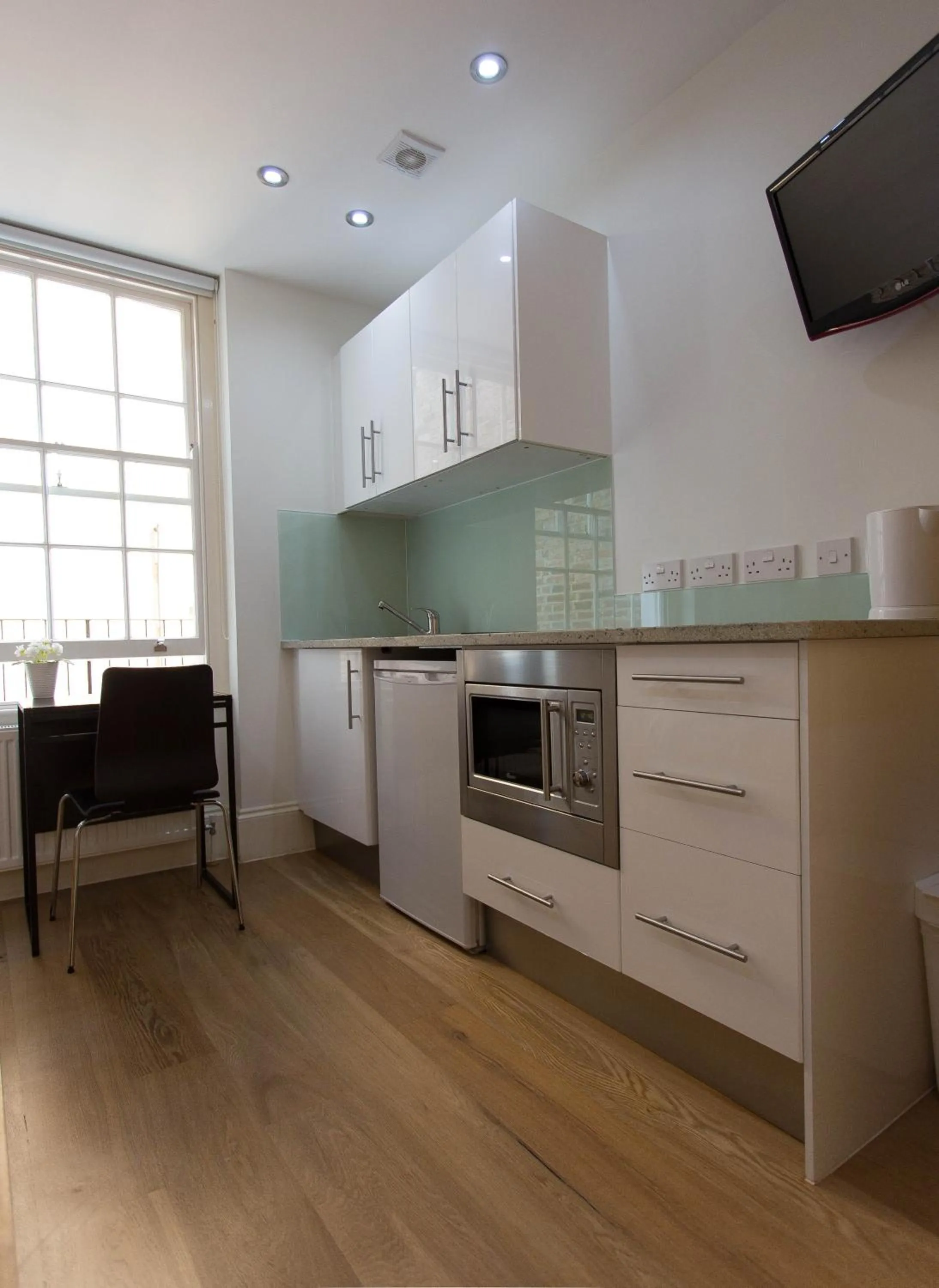 Kitchen or kitchenette in Paddington Green Serviced Apartments by Concept Apartments