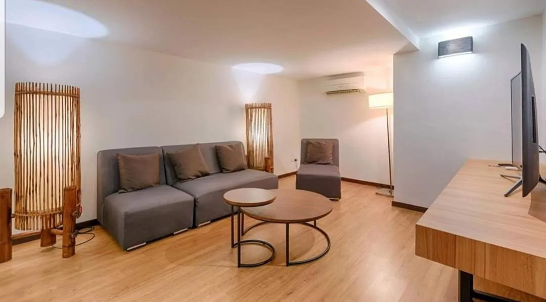 Communal lounge/ TV room in Lot 33 Boutique Hotel