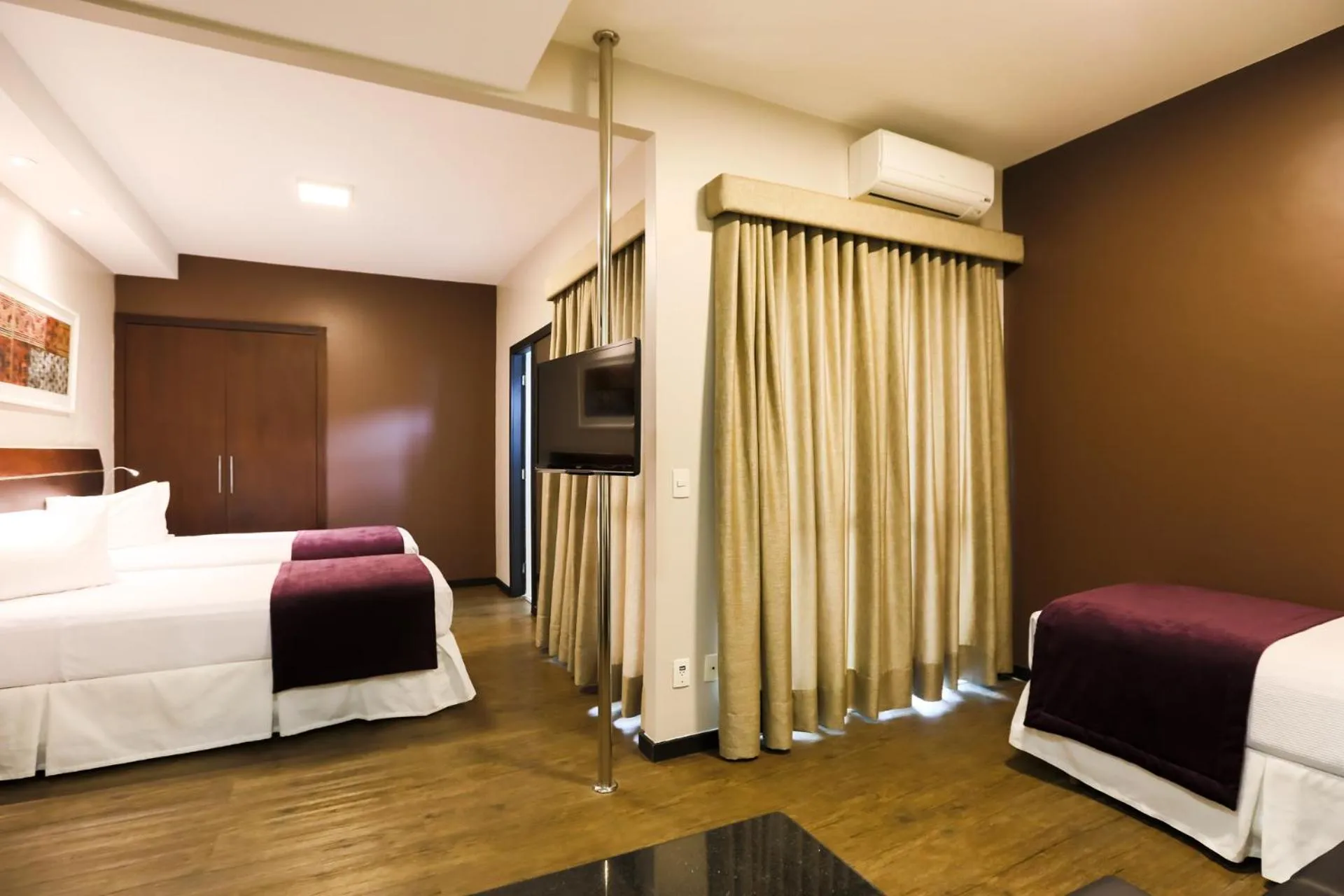 Bed in San Diego Suites Ipatinga