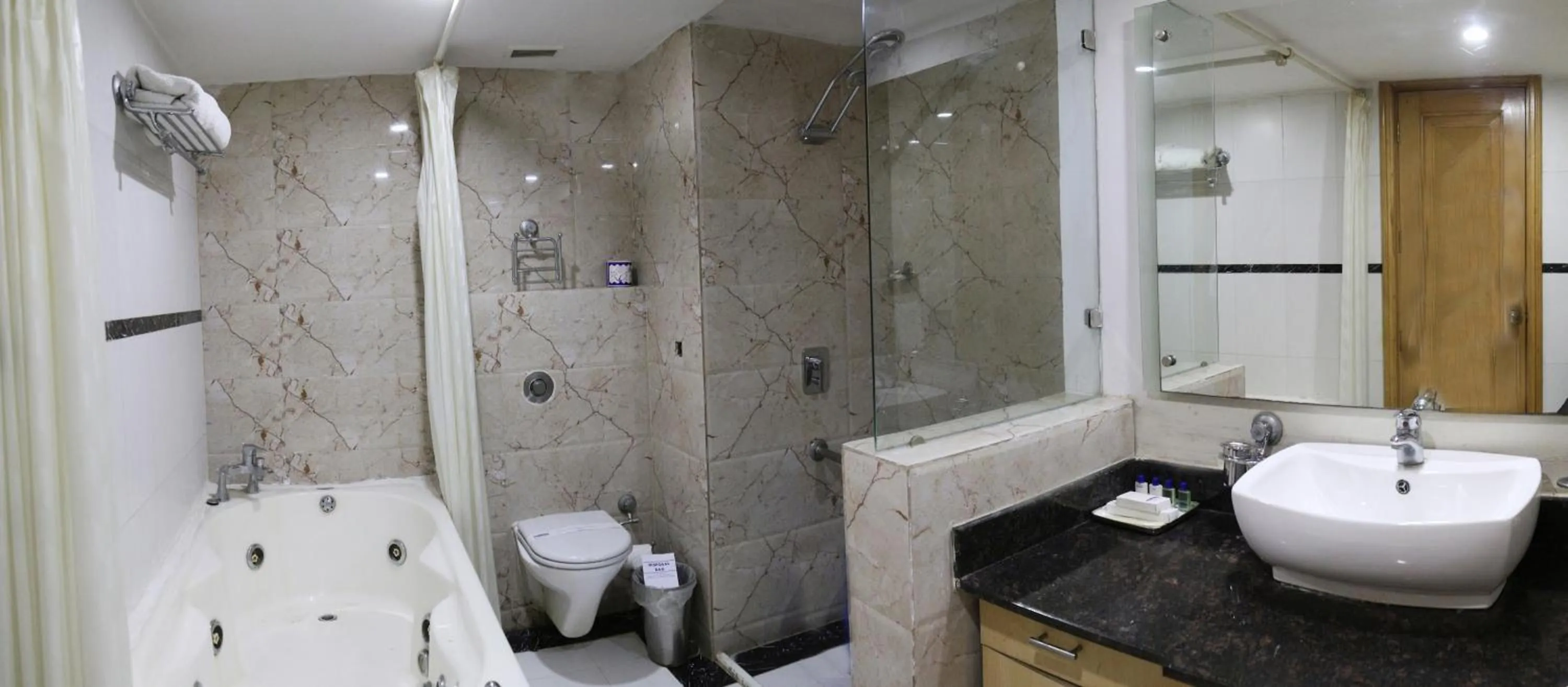 Bathroom in Dee Marks Airport Hotel & Resorts