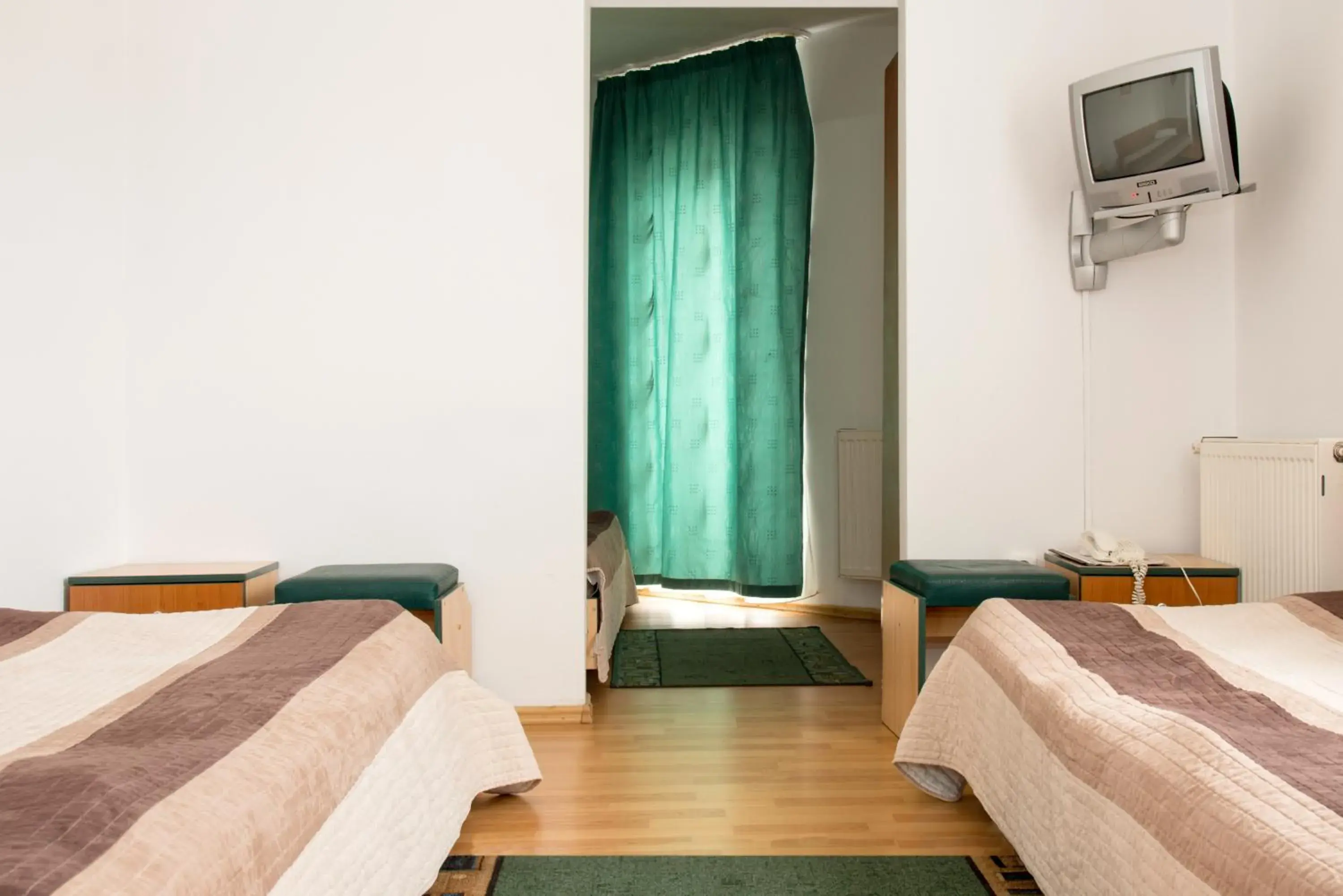 Triple Room in Hotel Beta Triple Room in Hotel Beta