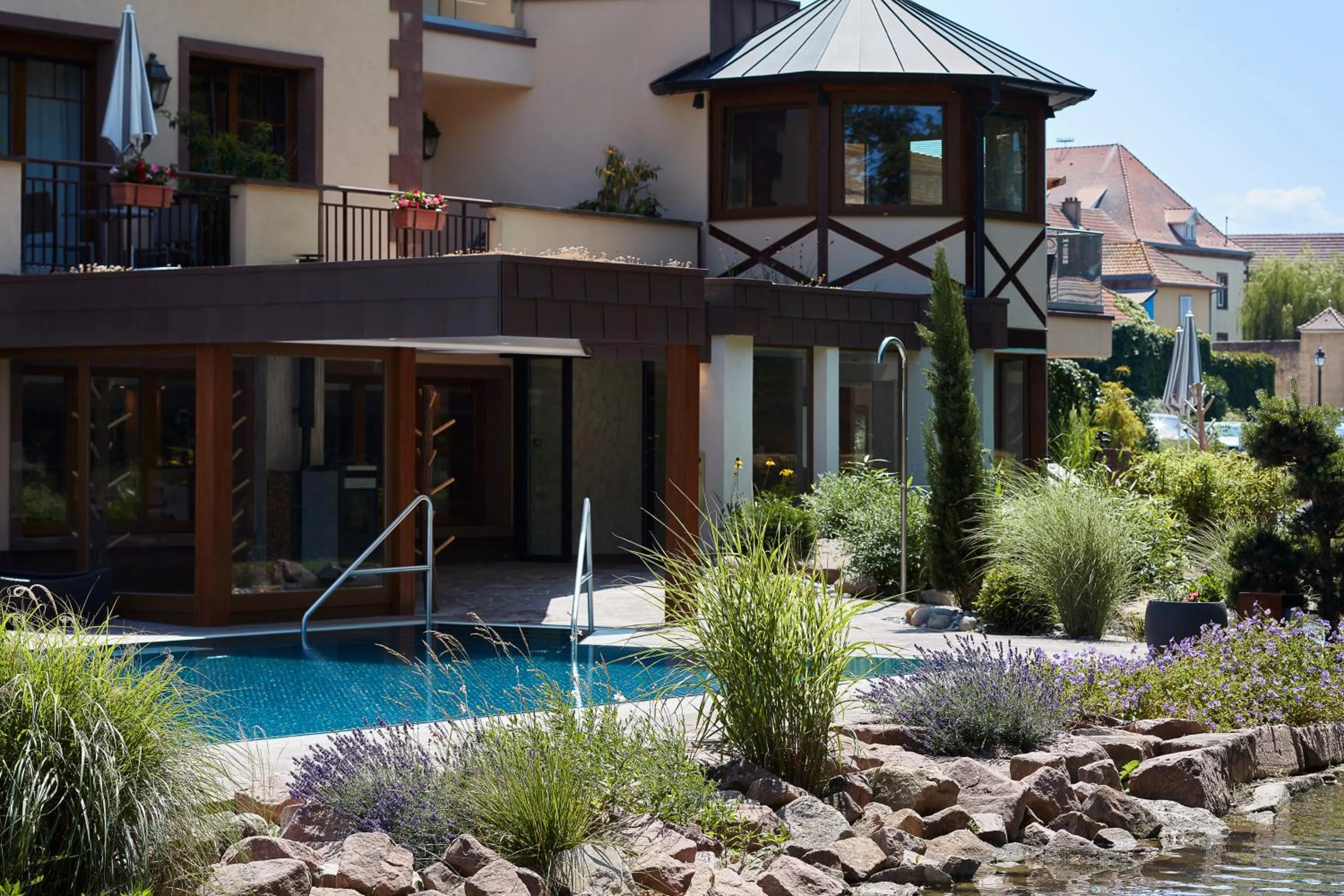 Swimming pool in Hotel Spa Restaurant Domaine du Moulin
