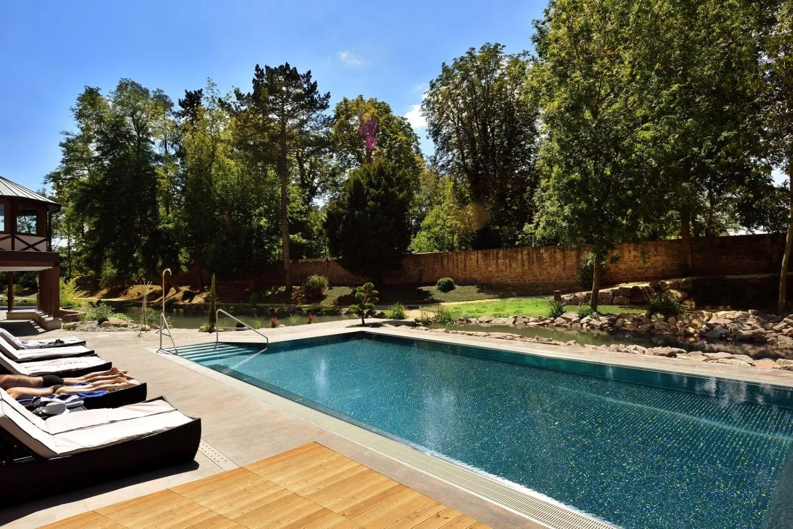 Swimming pool in Hotel Spa Restaurant Domaine du Moulin