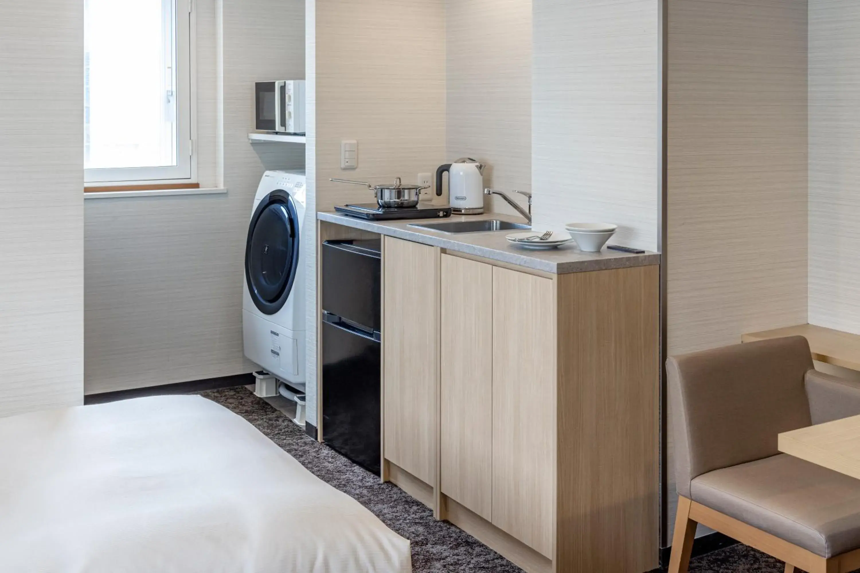 Kitchen or kitchenette, Bed in Tokyu Stay Tsukiji - Tokyo Ginza Area Kitchen or kitchenette, Bed in Tokyu Stay Tsukiji - Tokyo Ginza Area