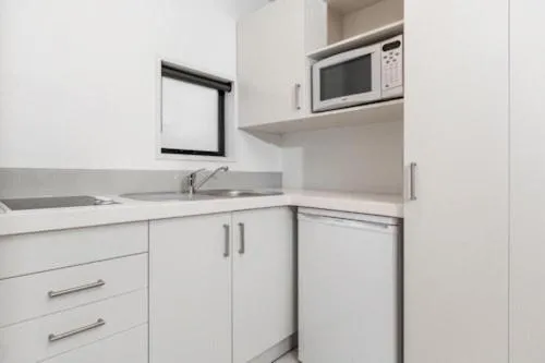 Kitchen or kitchenette in Palms Motel