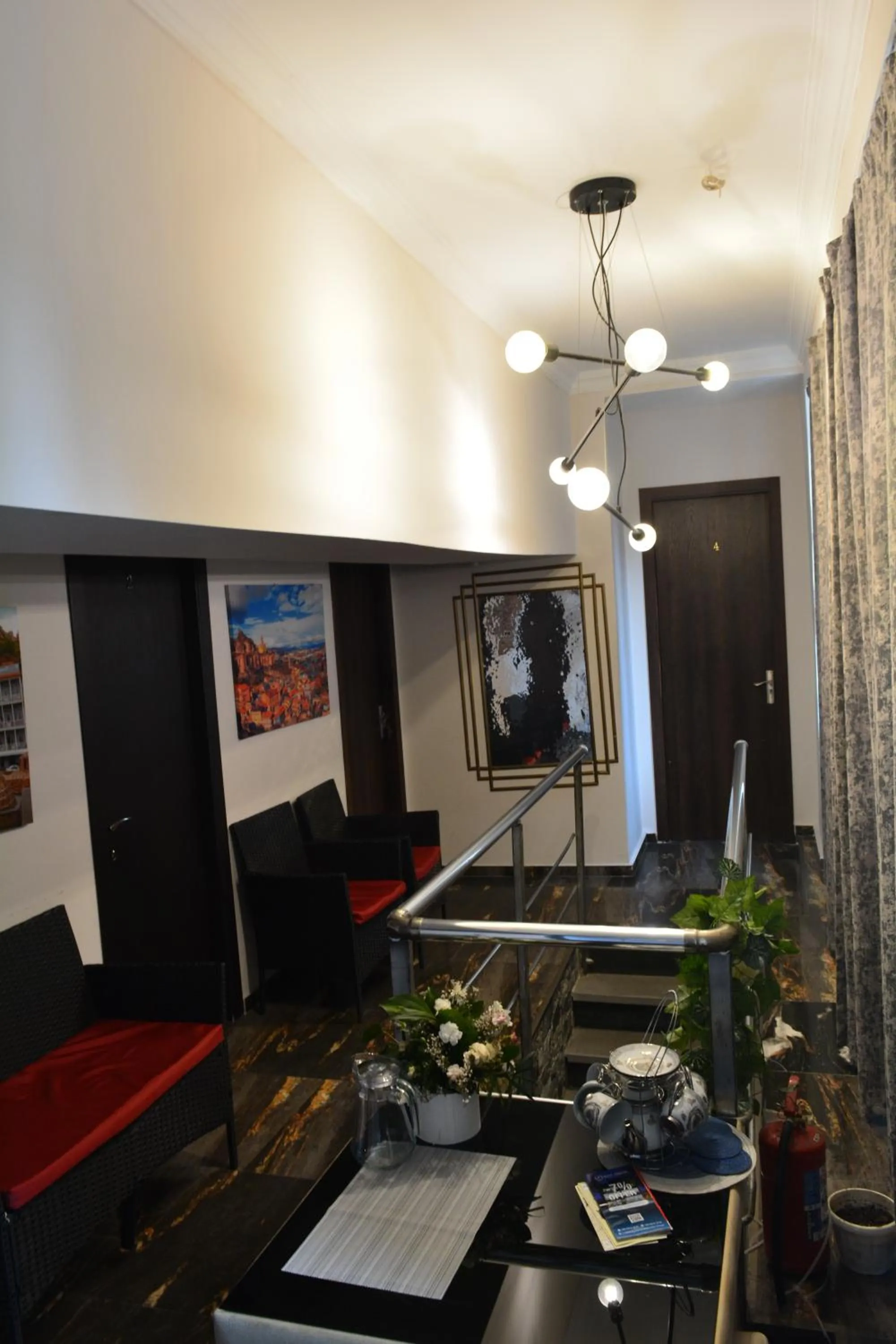 Communal lounge/ TV room in Nino's Hotel On Tsamebuli