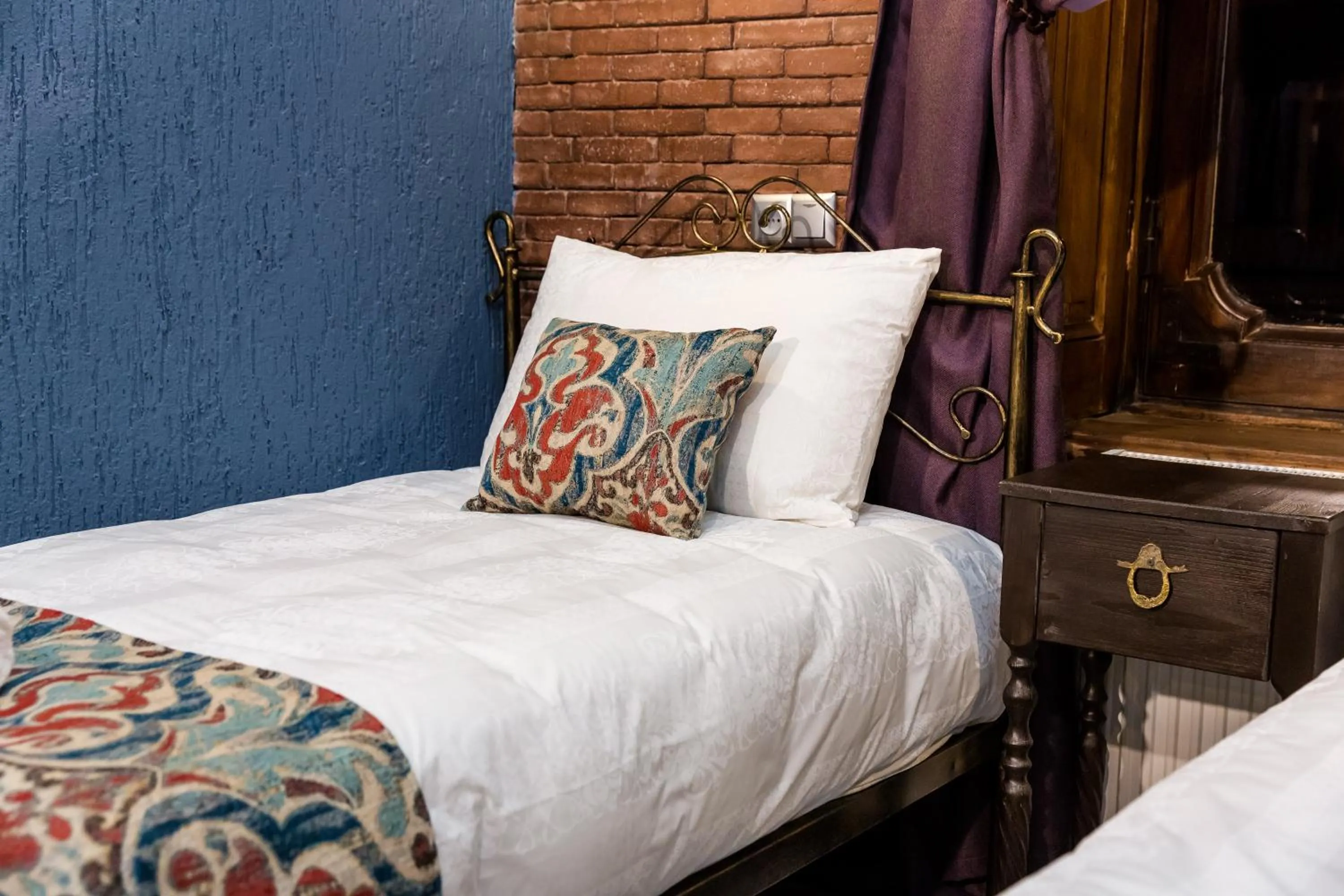 Bed in Tiflis Inn Boutique Hotel