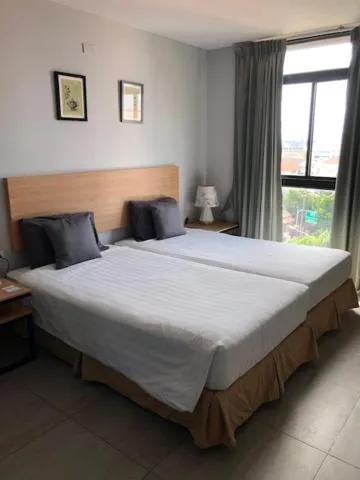 Bed in Vogue Pattaya Hotel