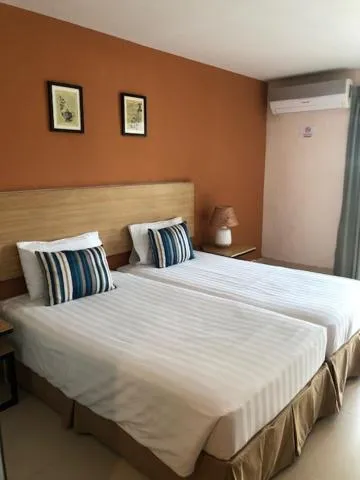 Bed in Vogue Pattaya Hotel