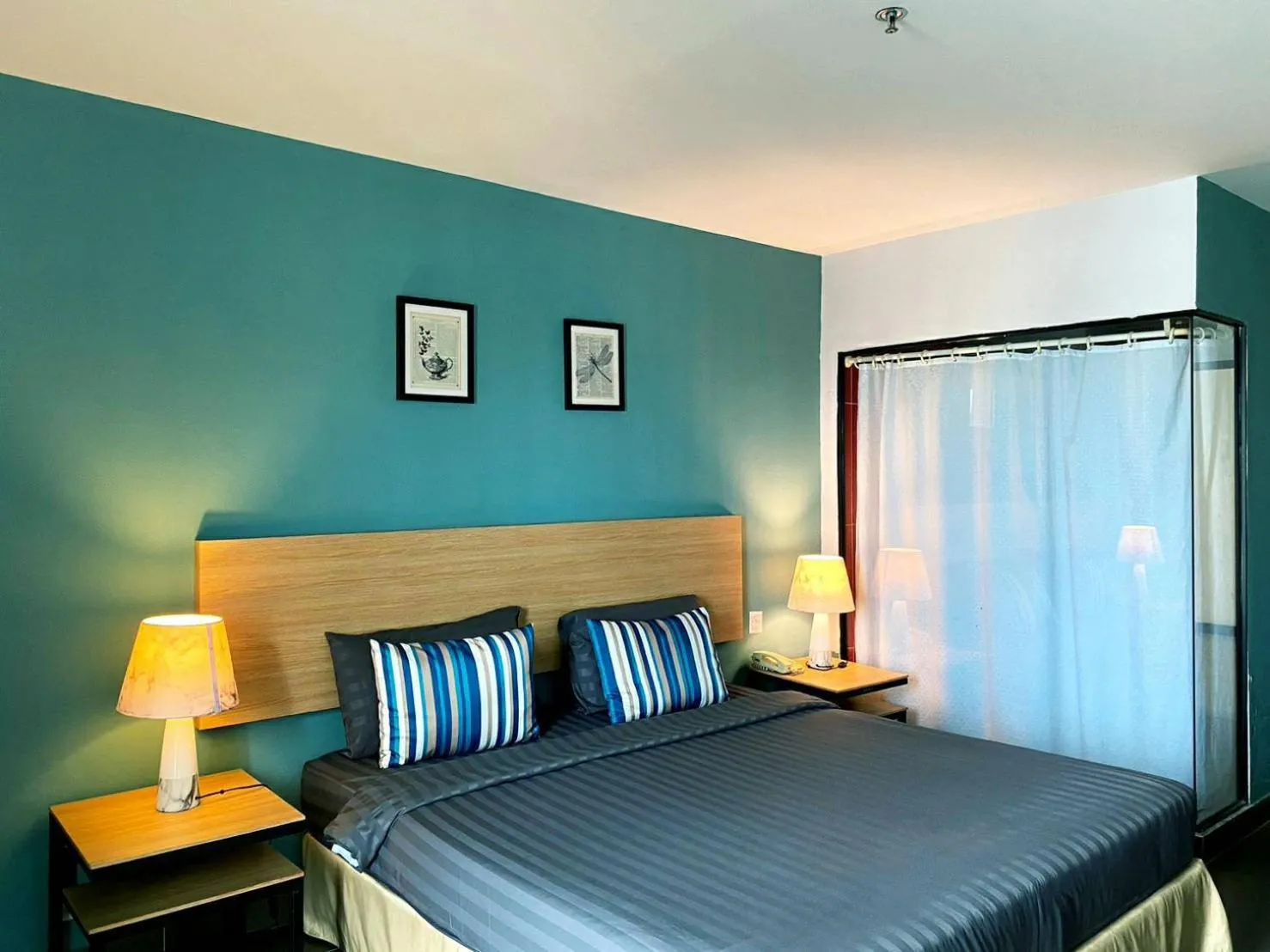 Bed in Vogue Pattaya Hotel