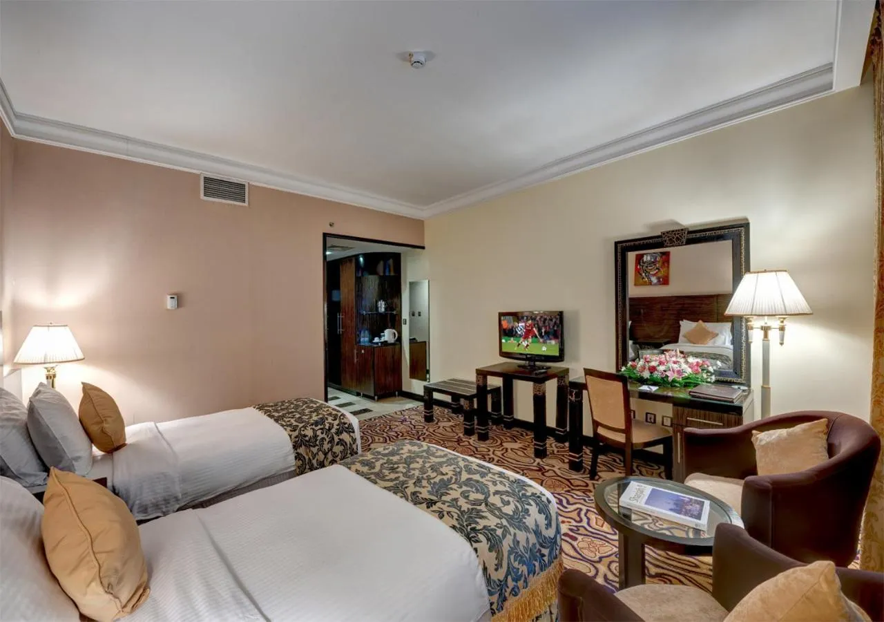 Photo of the whole room, Bed in Sharjah Palace Hotel