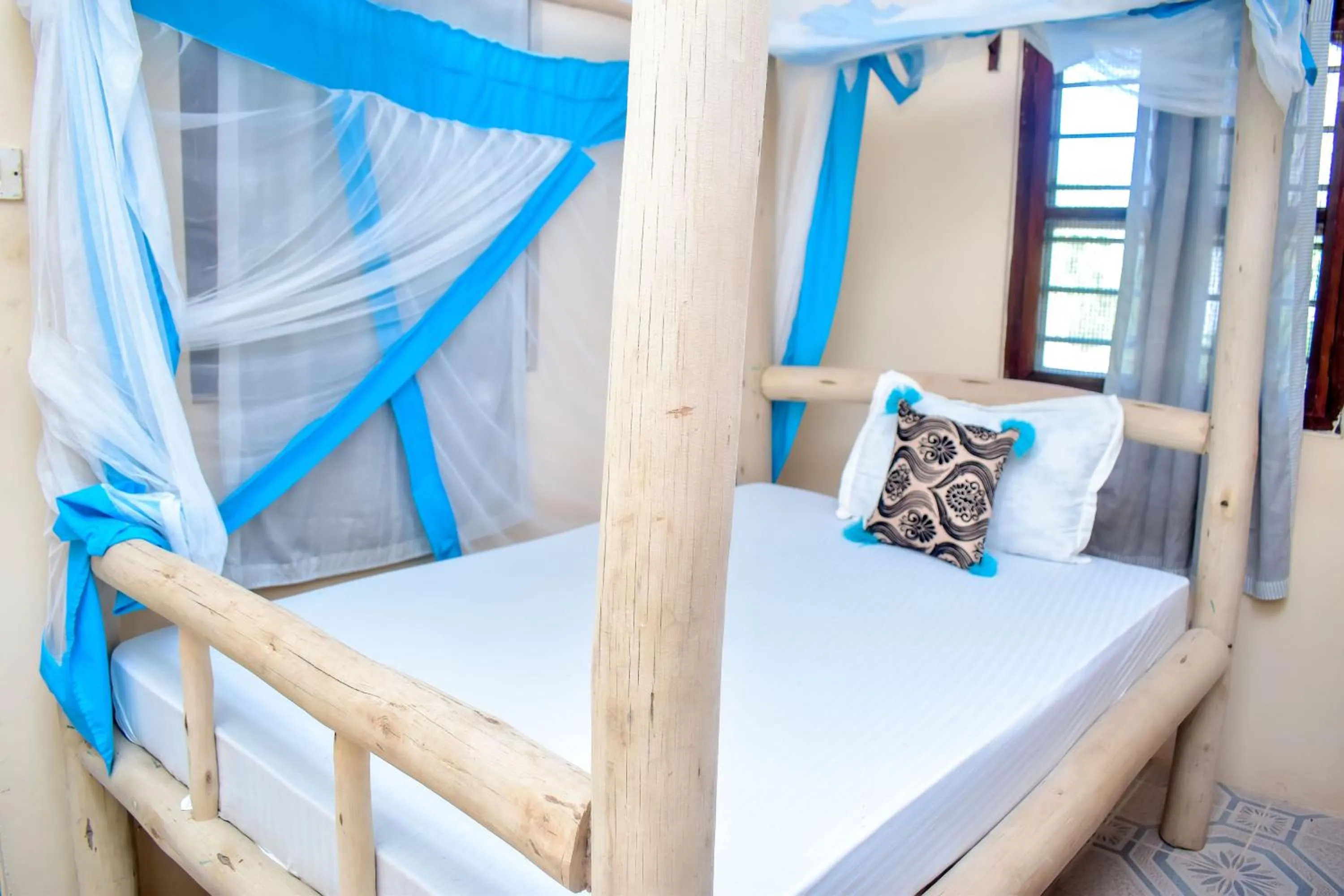 Bed in Blue Earth Beach Bungalow