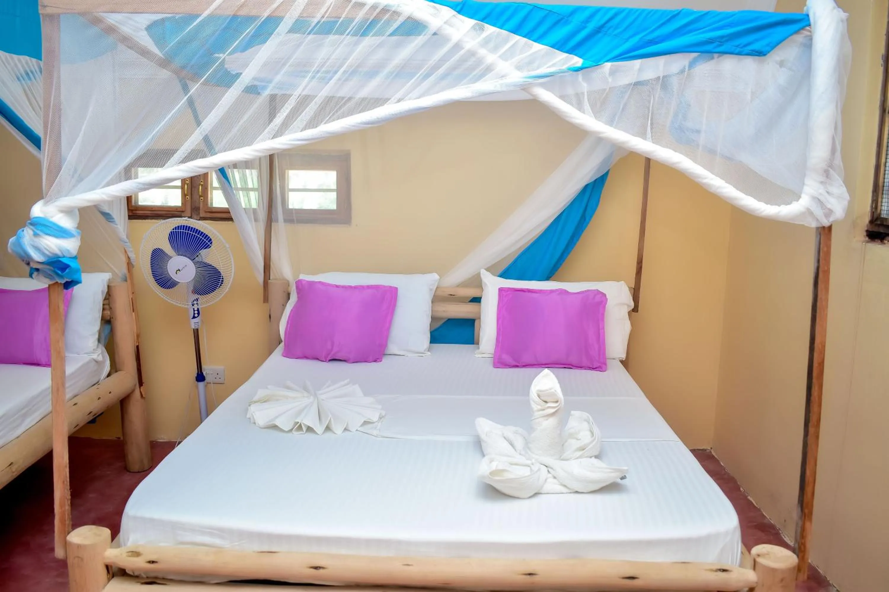 Bed in Blue Earth Beach Bungalow