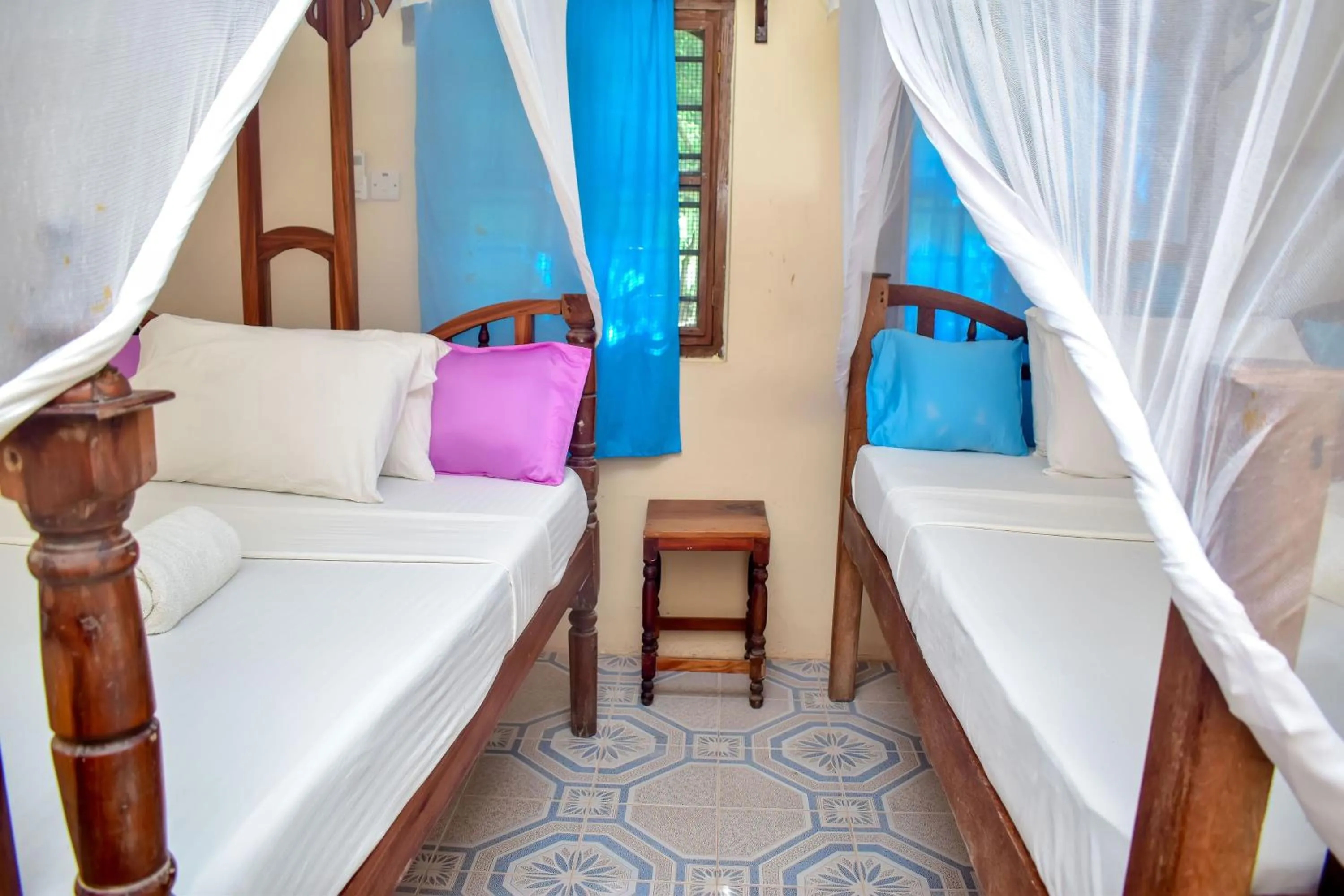 Bed in Blue Earth Beach Bungalow