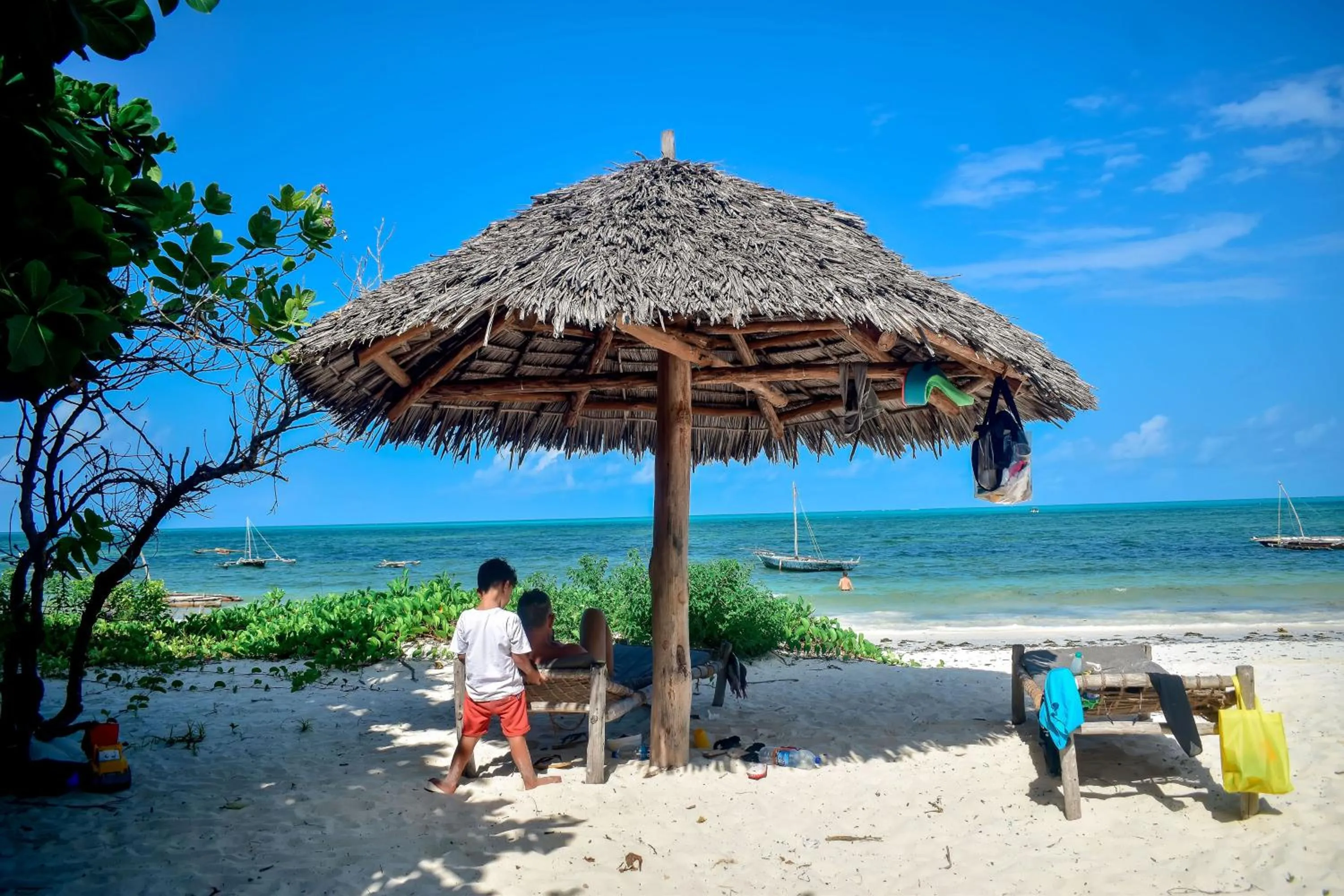 People in Blue Earth Beach Bungalow