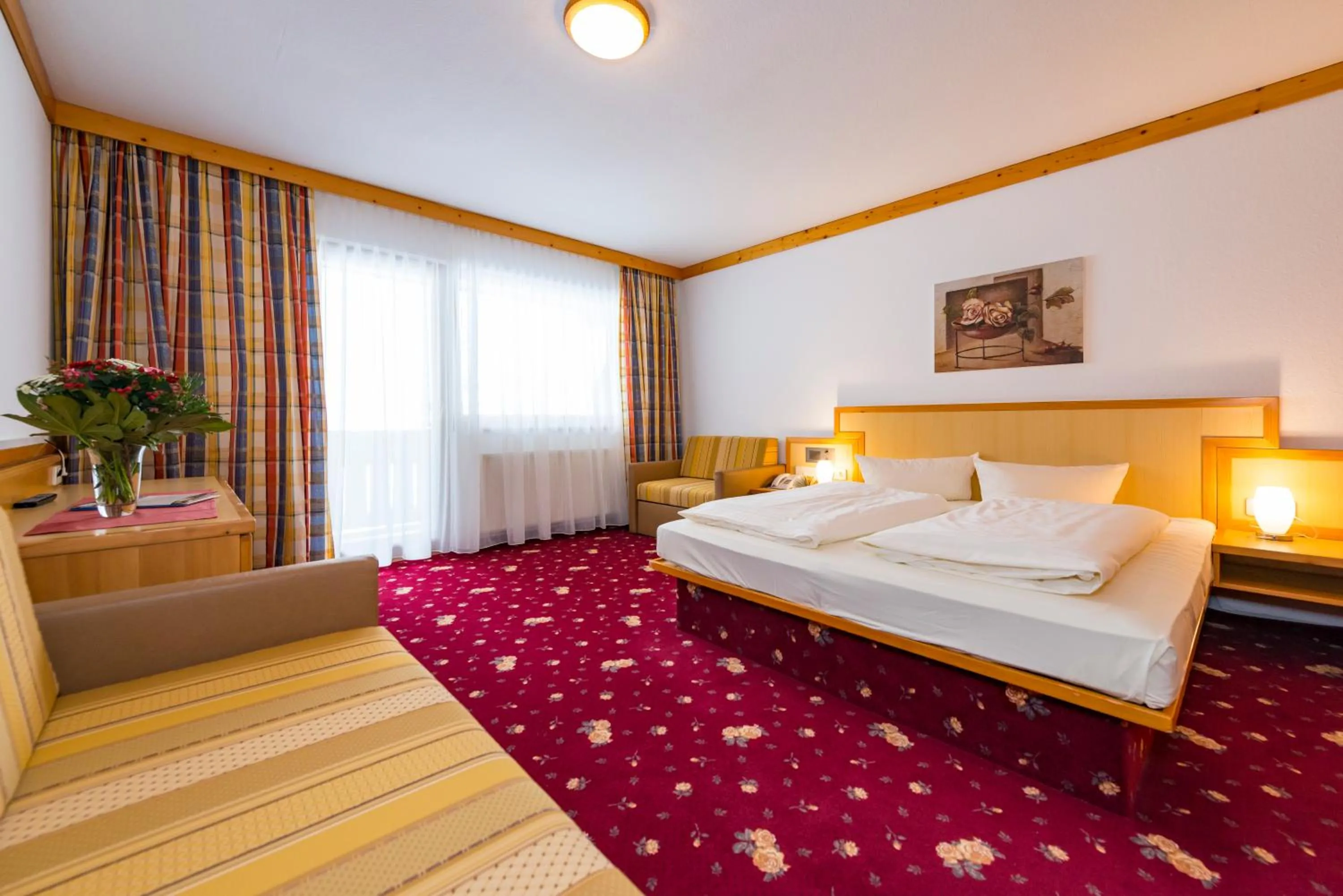 Photo of the whole room, Bed in Alpensporthotel Mutterberg