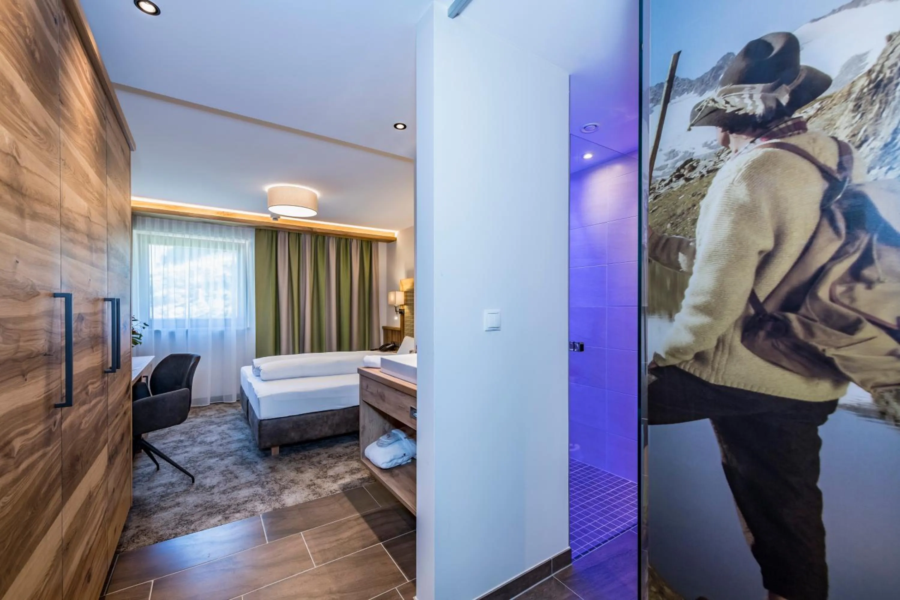 Photo of the whole room, Bed in Alpensporthotel Mutterberg