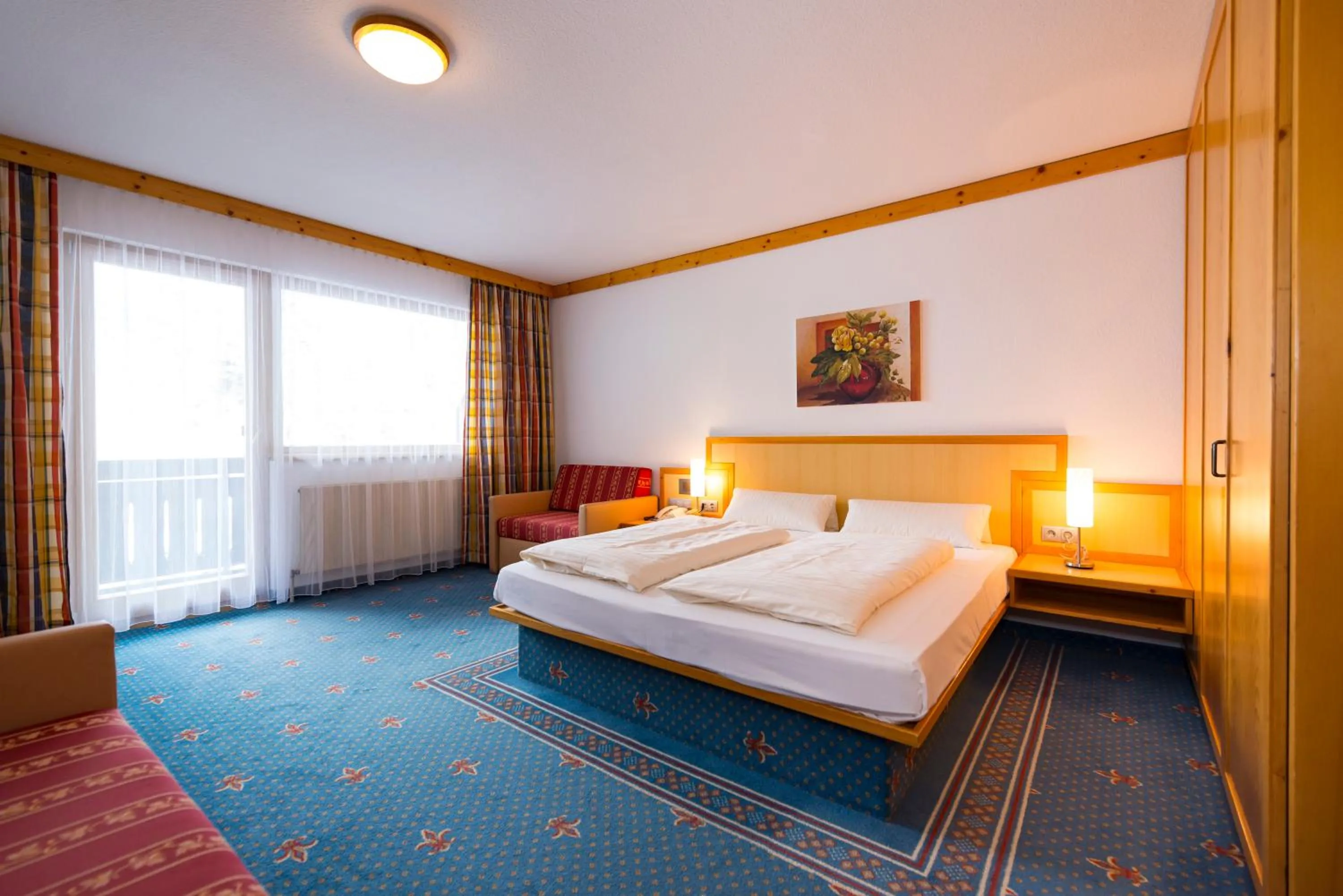 Bedroom, Bed in Alpensporthotel Mutterberg