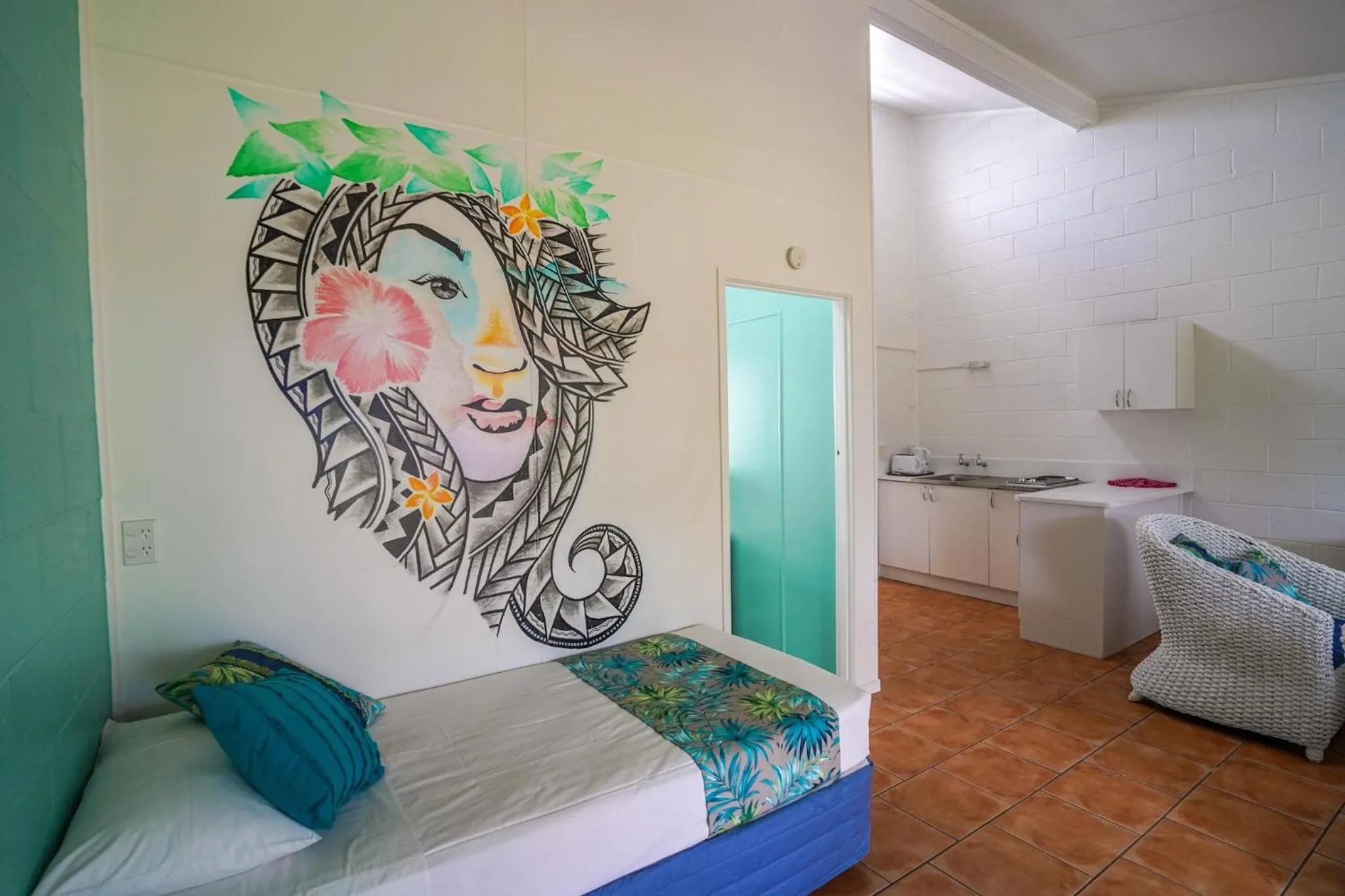 Bed in The Black Pearl Beachside Apartments