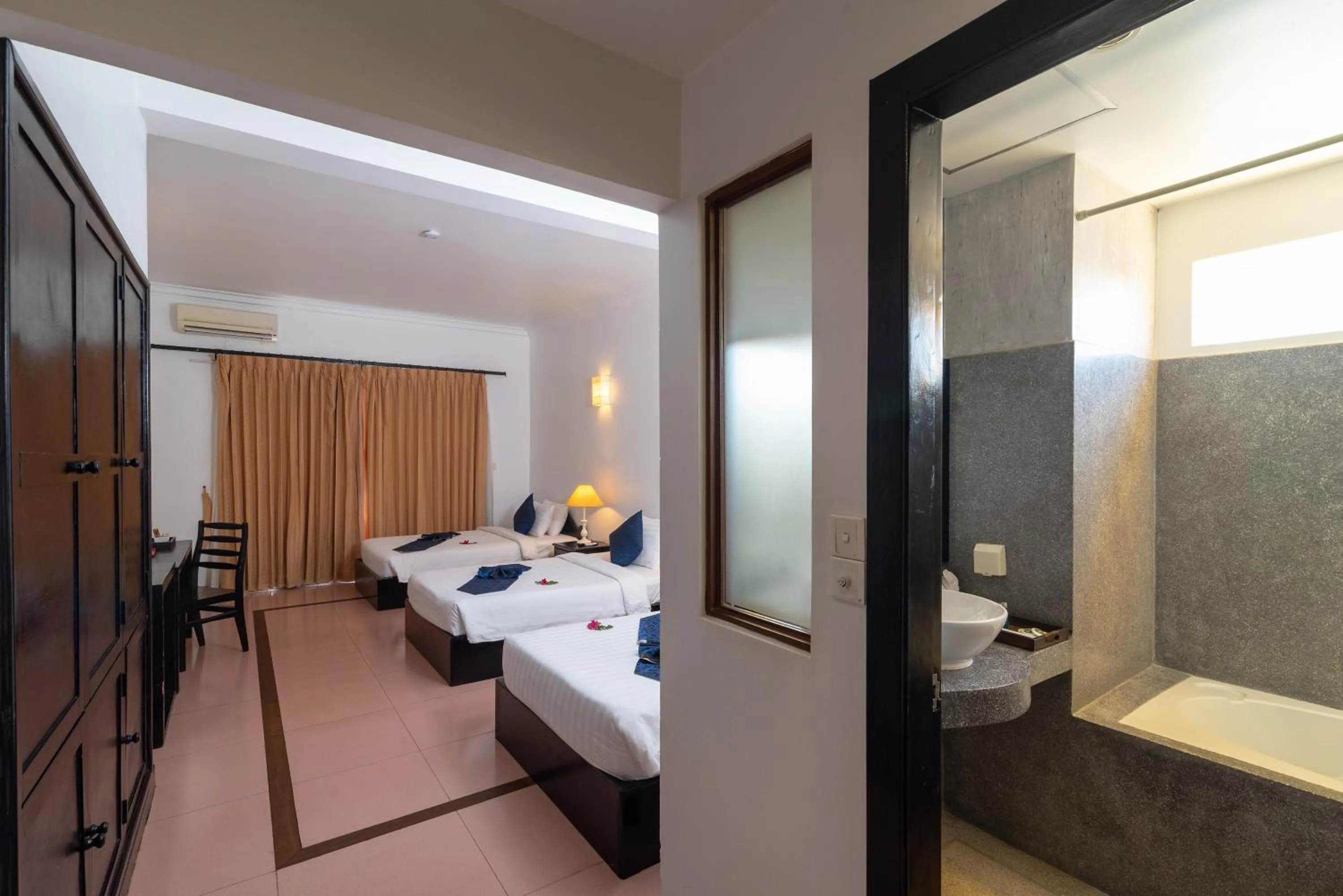 Bed in Amber Angkor Villa Hotel & Spa