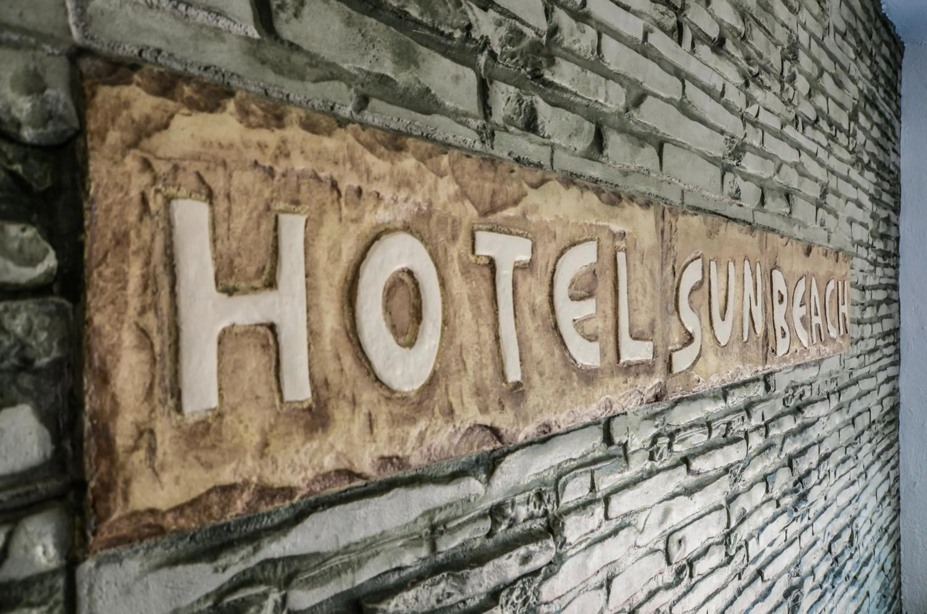 Property logo or sign in Sun Beach Hotel