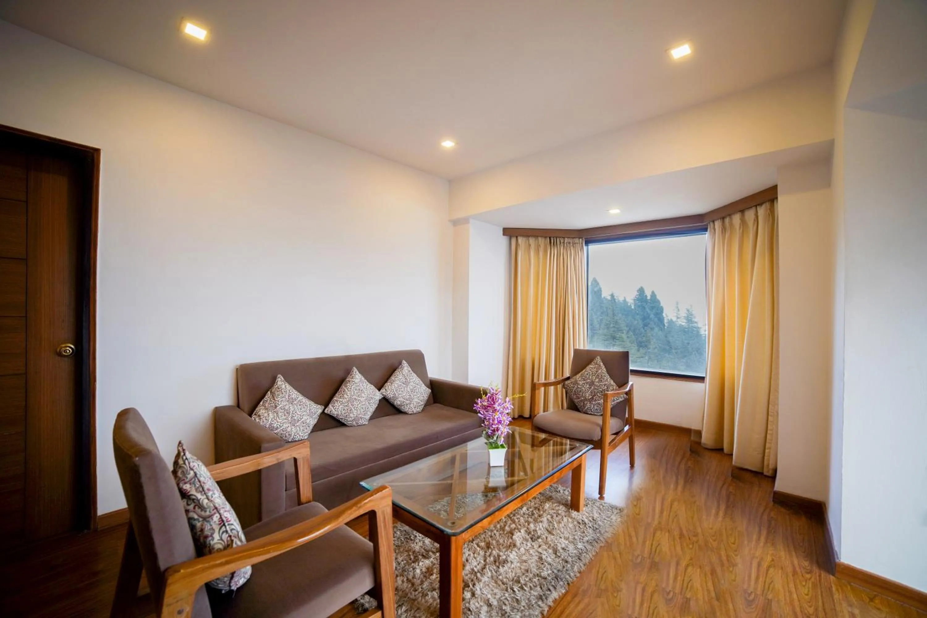 Seating area in Country Inn Premier Pacific Mall Road Mussoorie