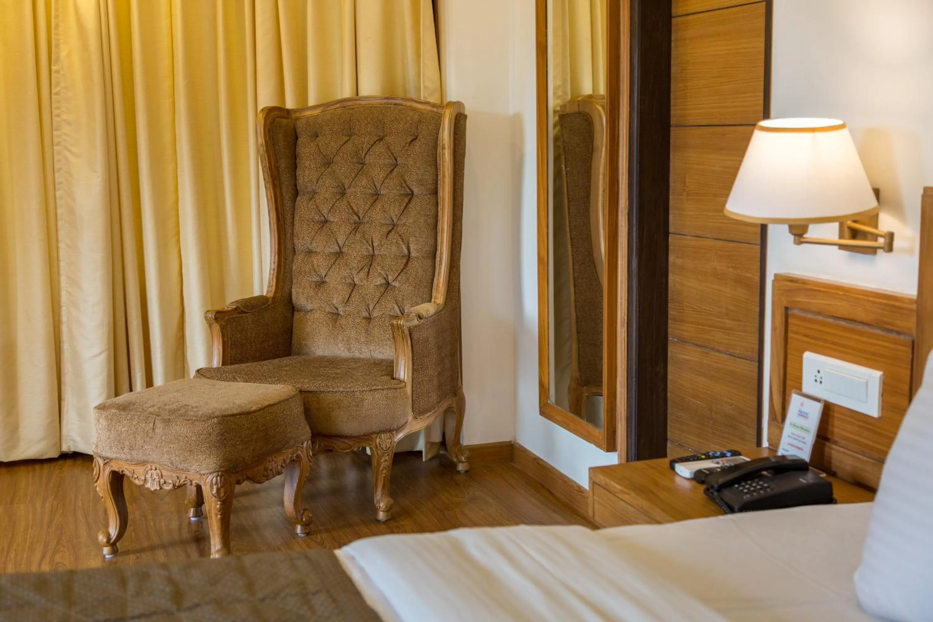 Seating area, Bed in Country Inn Premier Pacific Mall Road Mussoorie