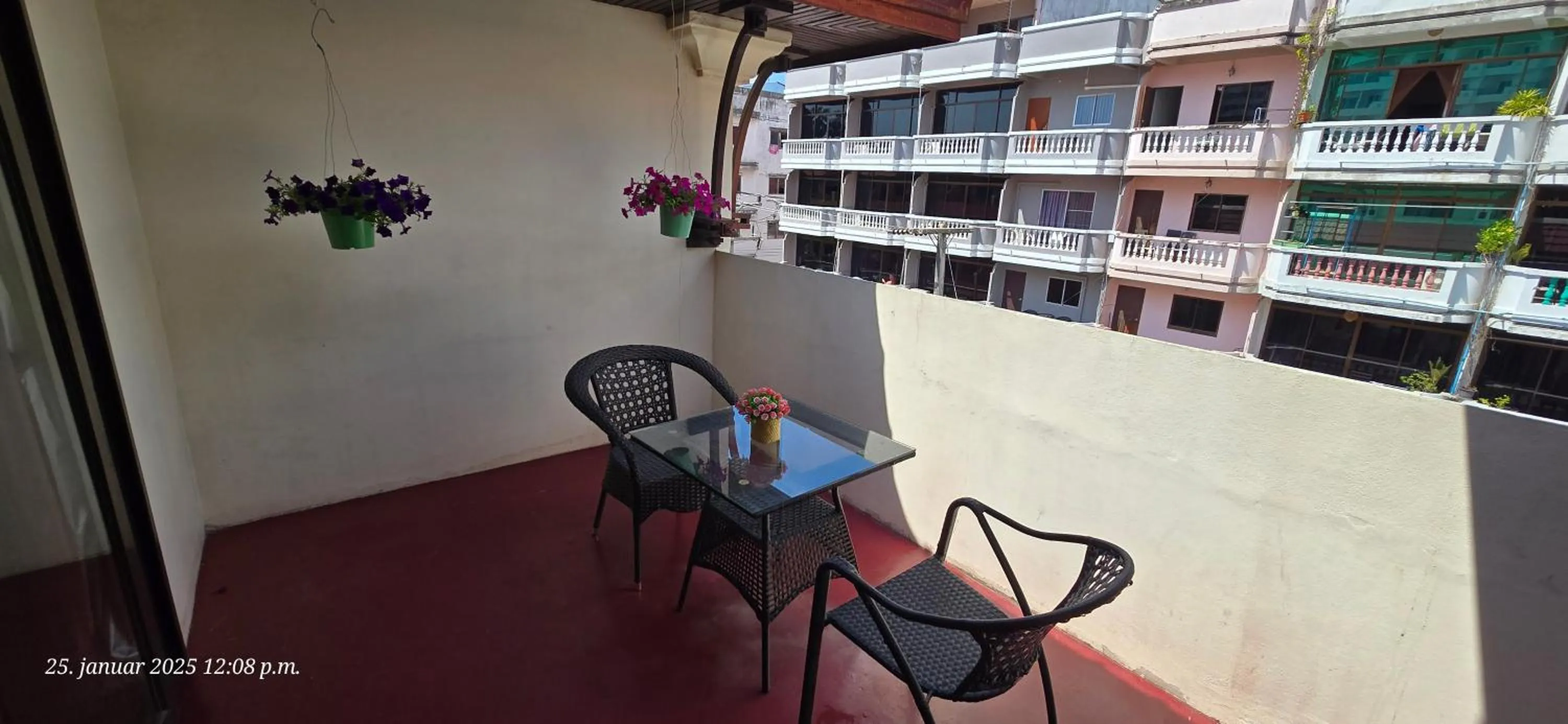 Communal lounge/ TV room in Nirvana Boutique Suites