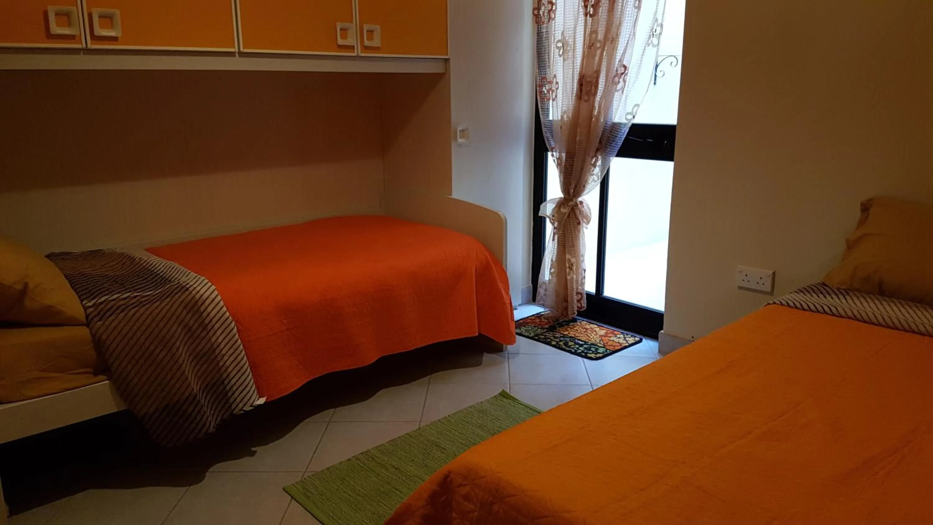 Bed in Aurora Apartment
