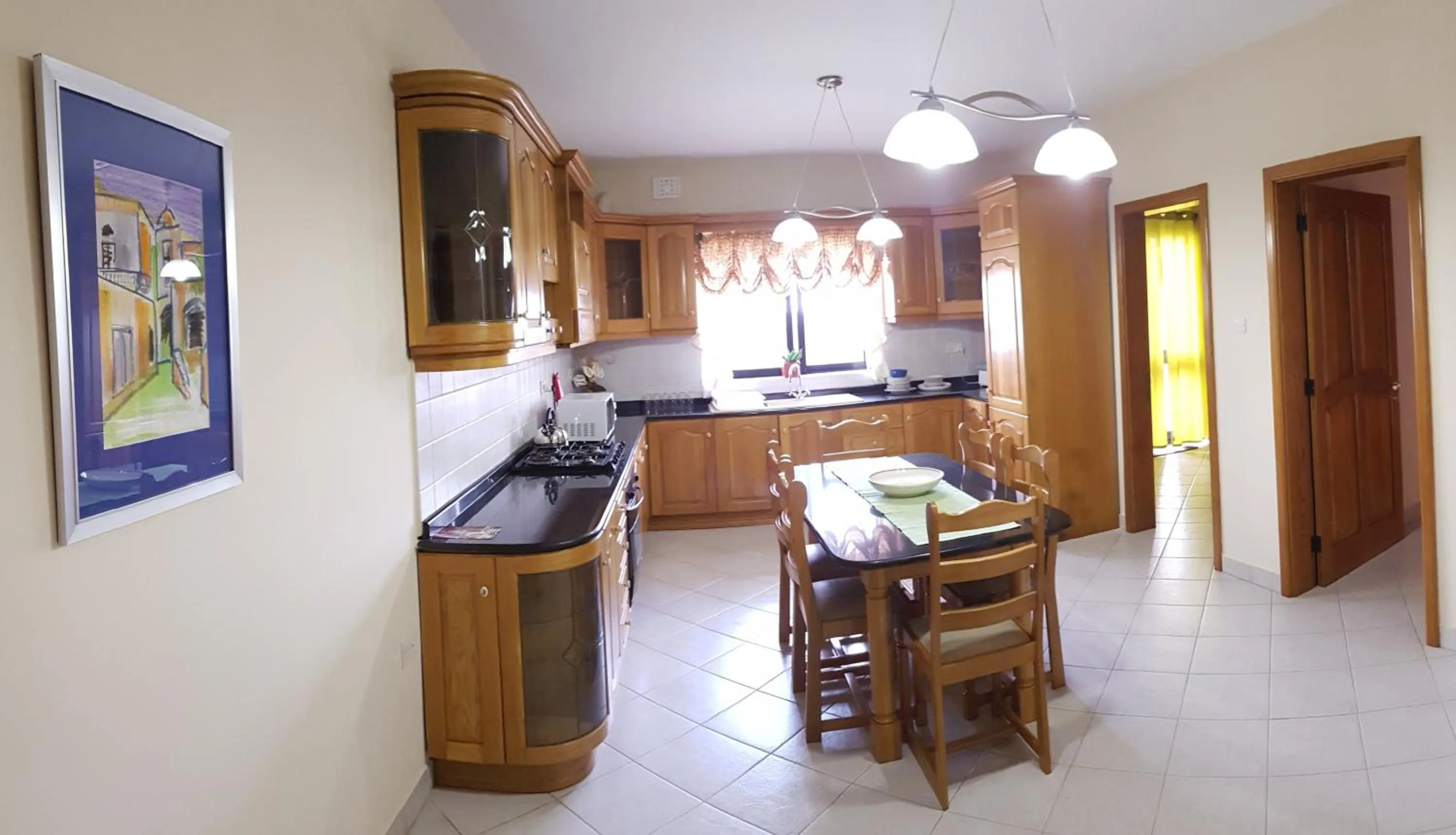 Kitchen or kitchenette in Aurora Apartment