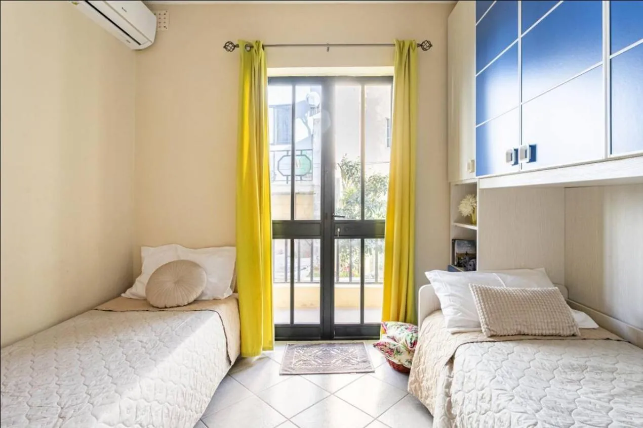 Bed in Aurora Apartment