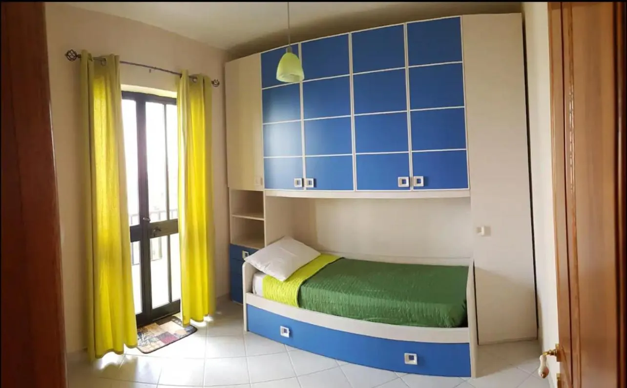 Bed in Aurora Apartment