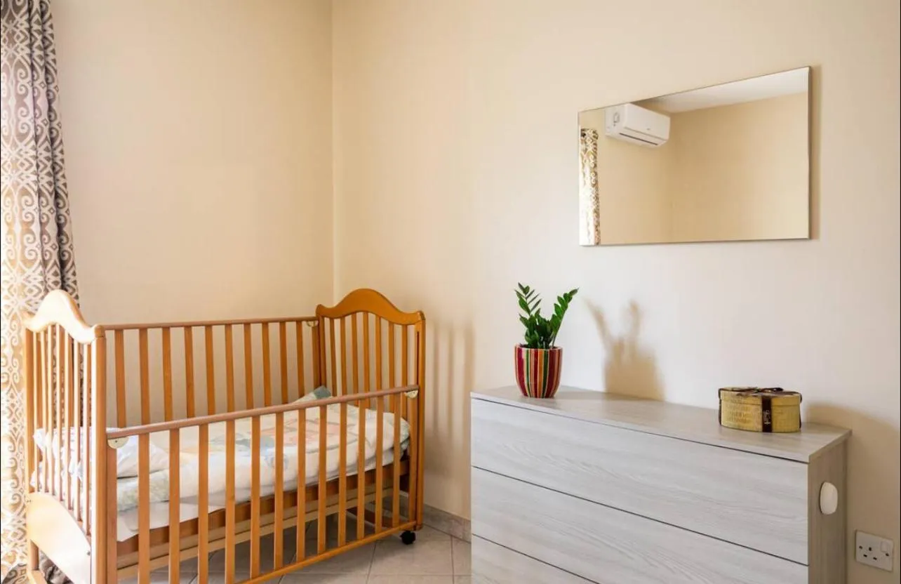 Bed in Aurora Apartment