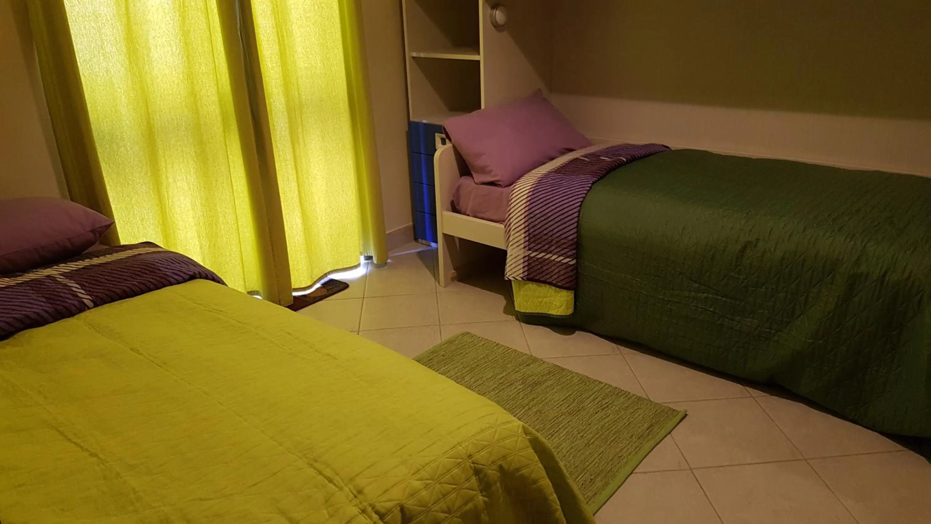 Bed in Aurora Apartment