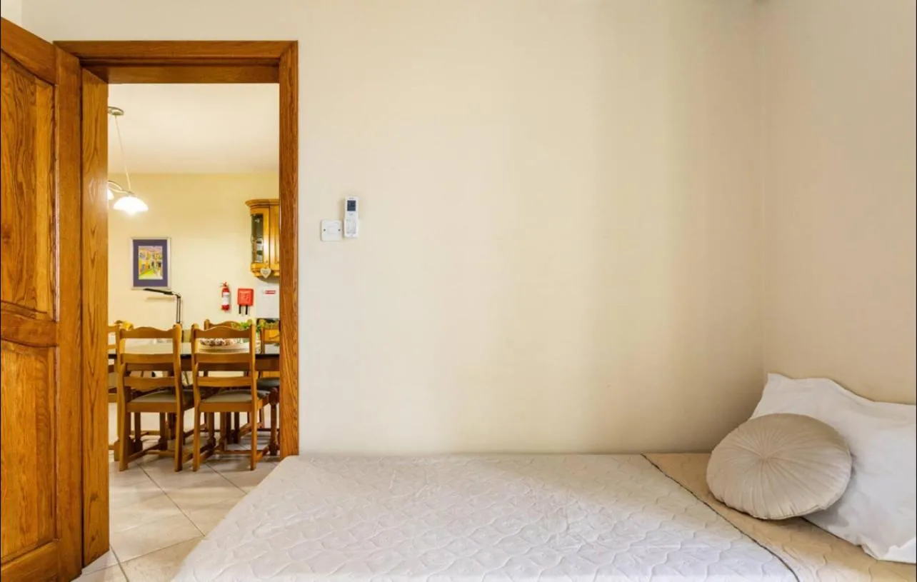 Bed in Aurora Apartment