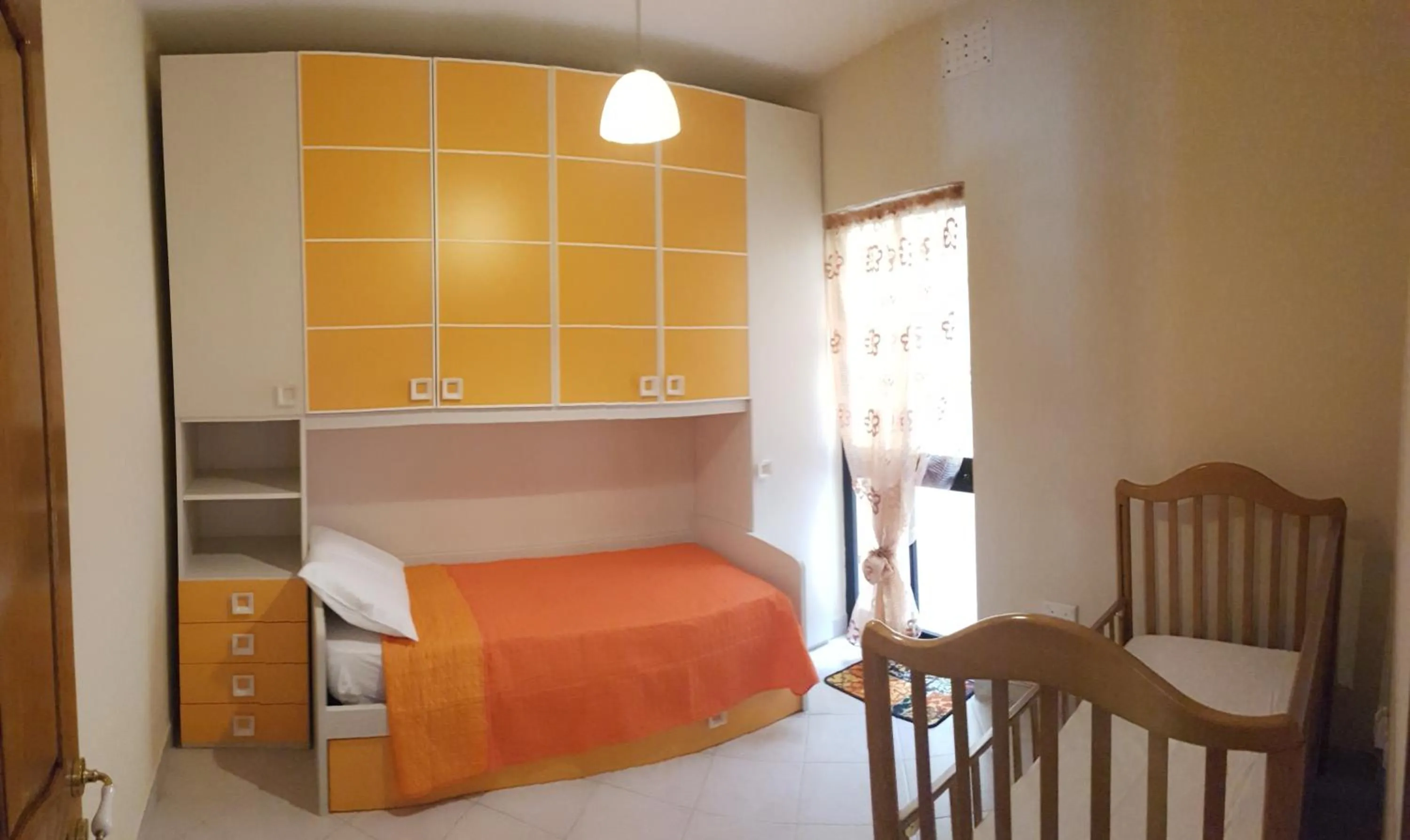 Bed in Aurora Apartment