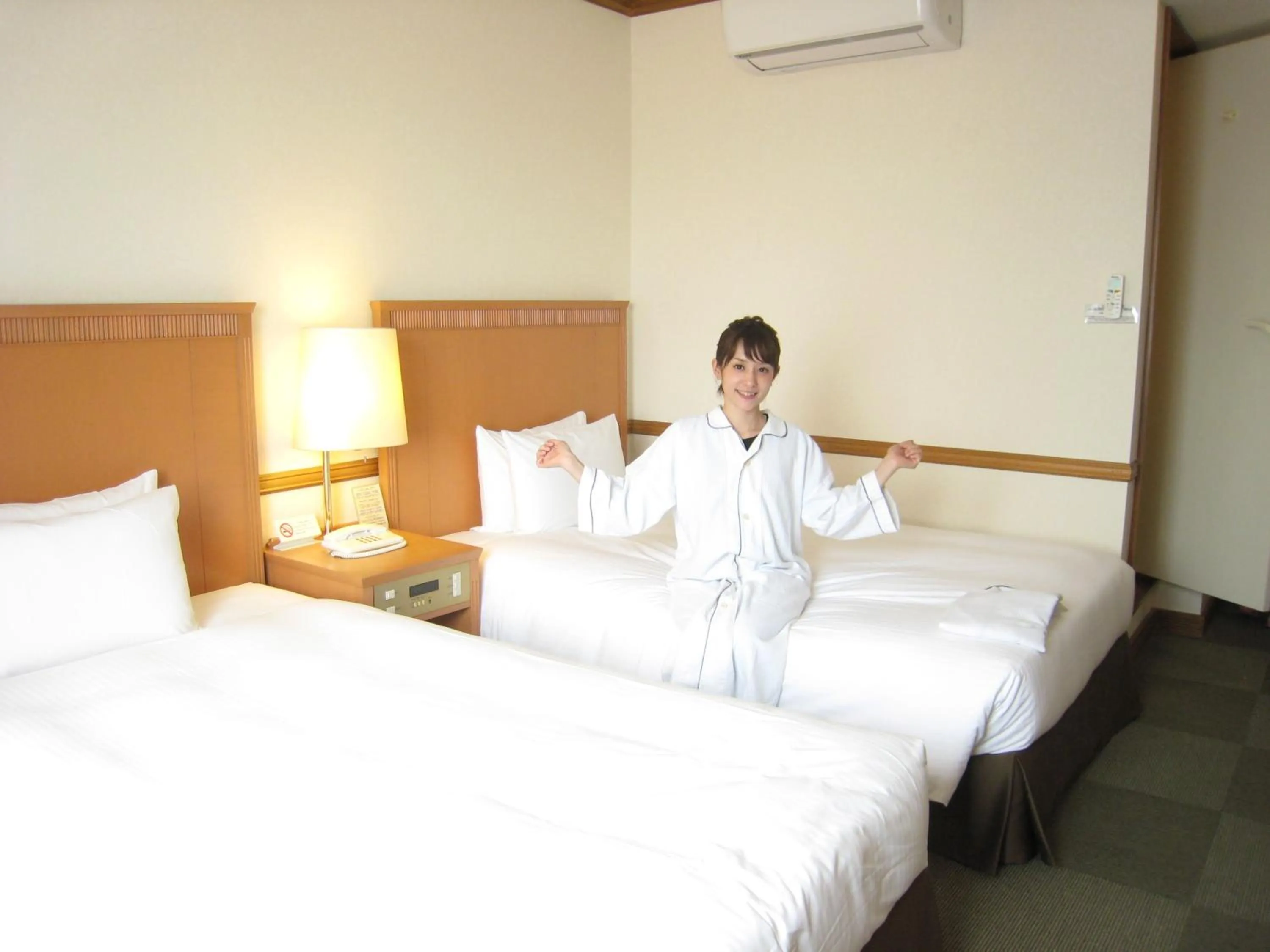 Bed in Hotel Azat Naha