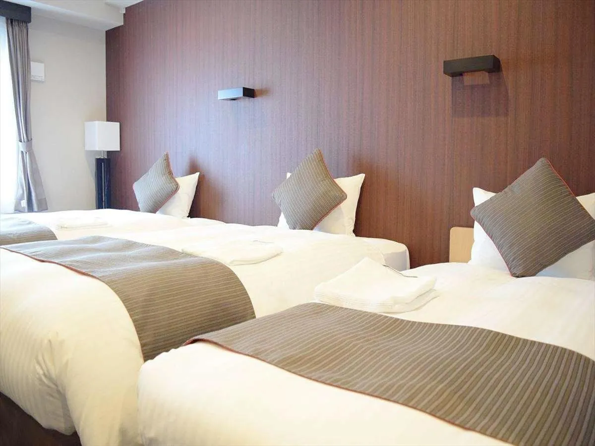 Bed in Hotel Azat Naha