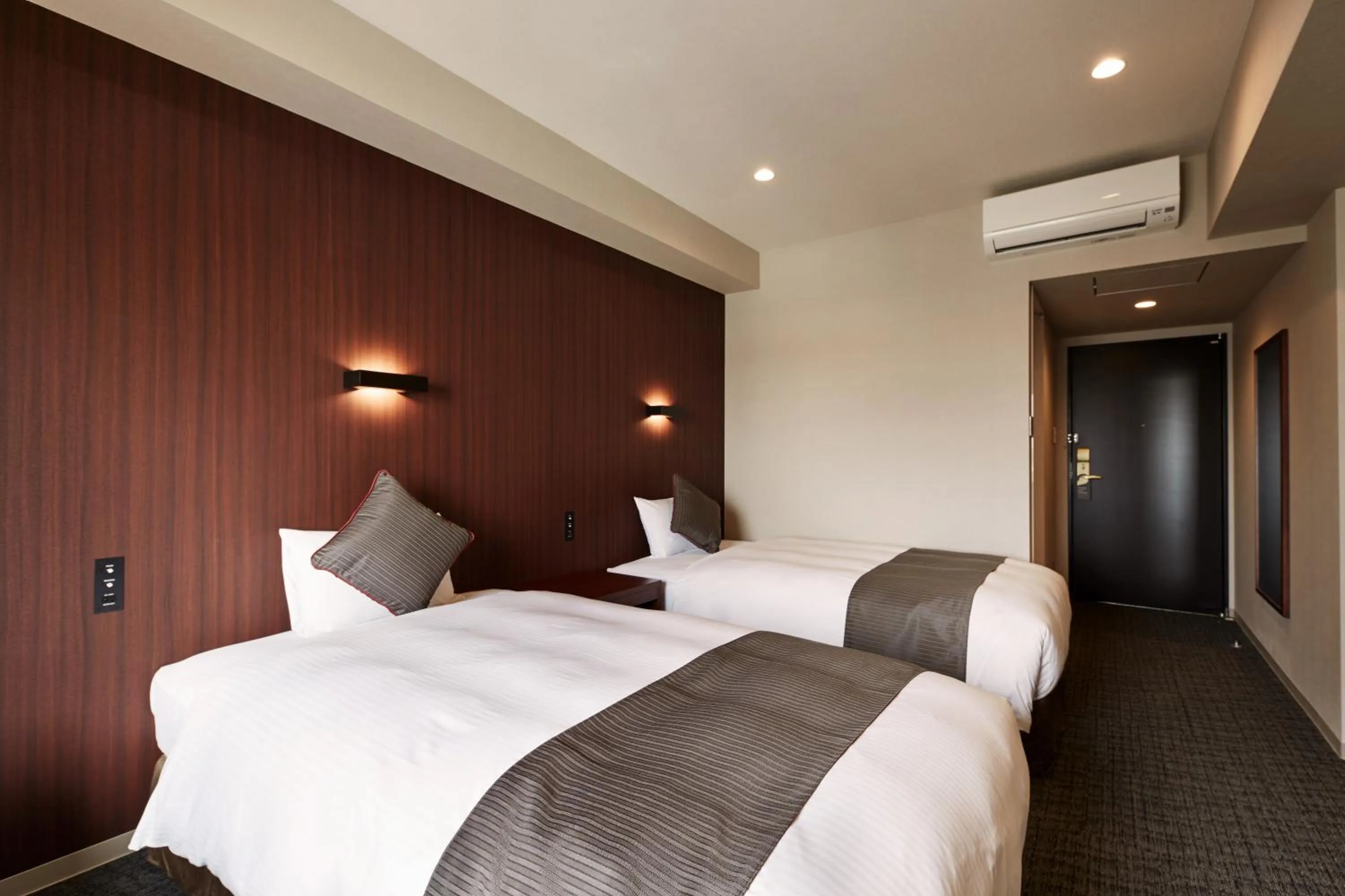 Bed in Hotel Azat Naha