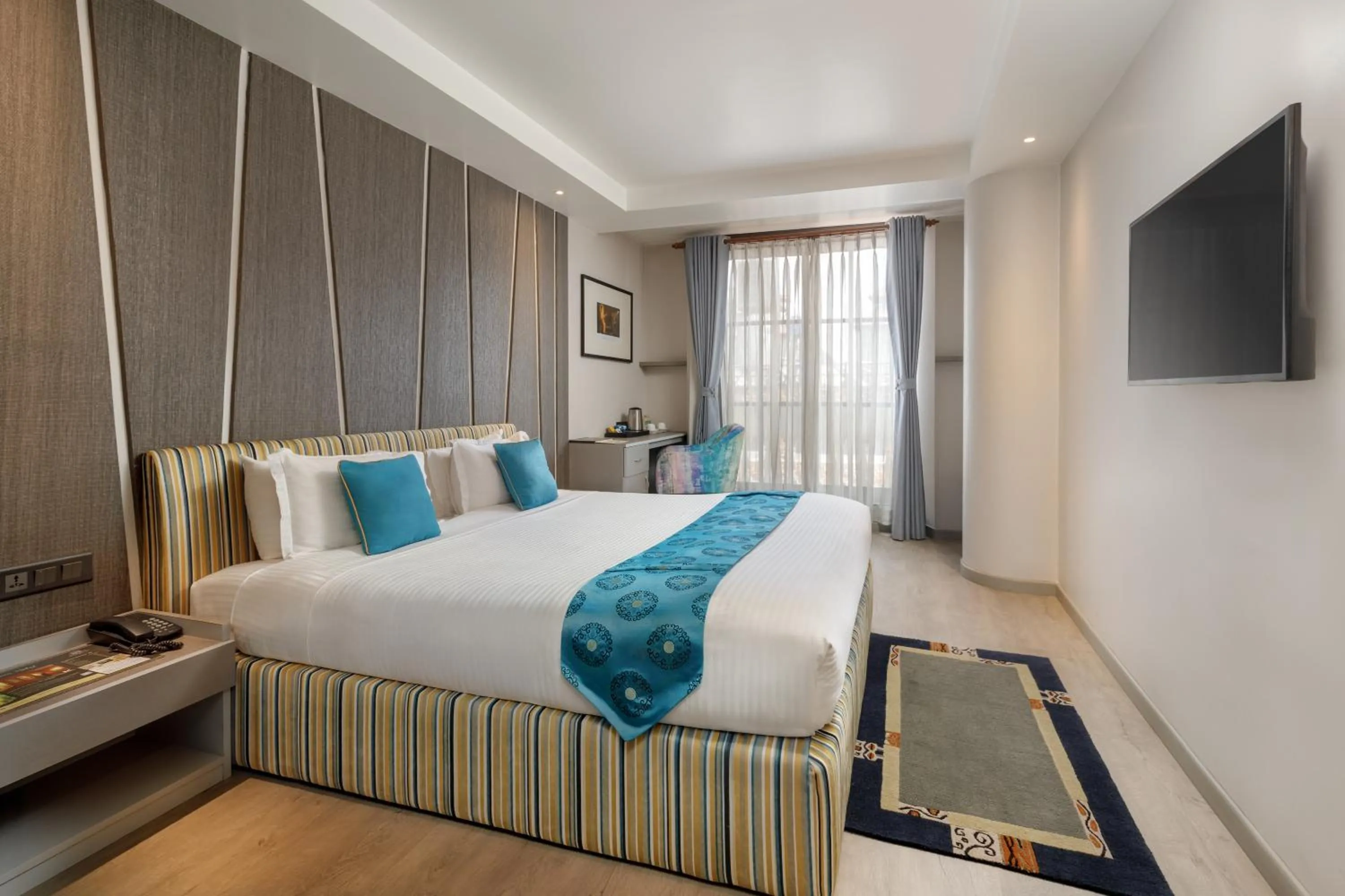 Communal lounge/ TV room, Bed in Kathmandu Guest House by KGH Group