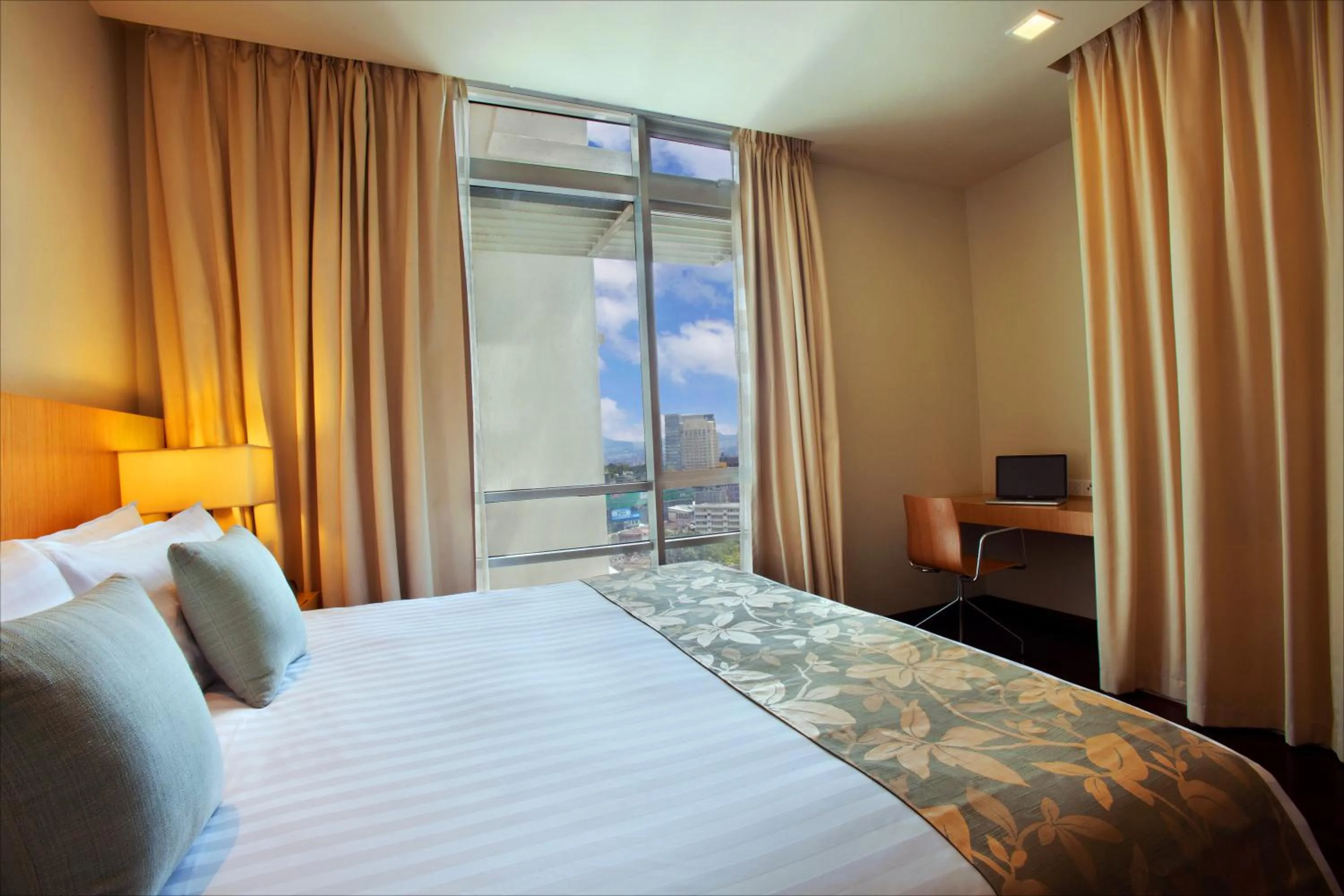 Bed in PARKROYAL Serviced Suites Kuala Lumpur