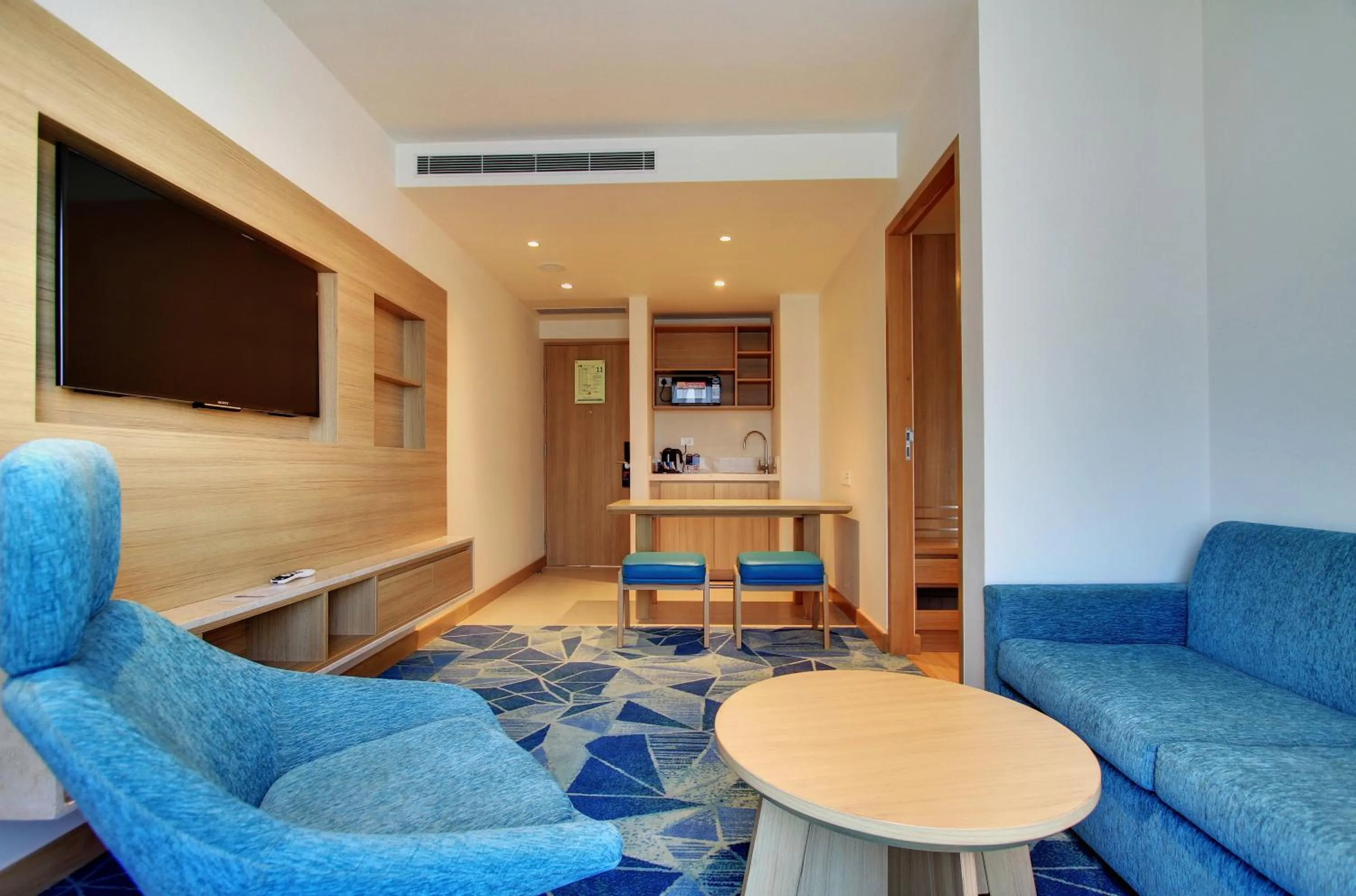 Seating area in Holiday Inn Bengaluru Racecourse by IHG