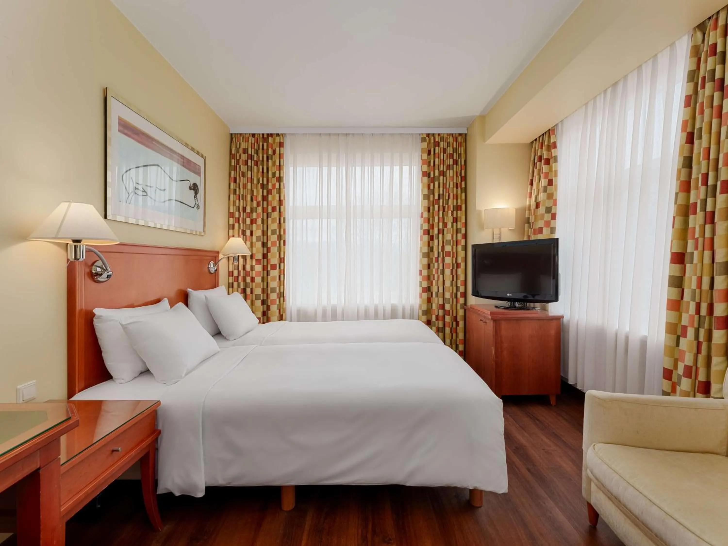 Communal lounge/ TV room, Bed in Radisson Blu Ridzene Hotel, Riga