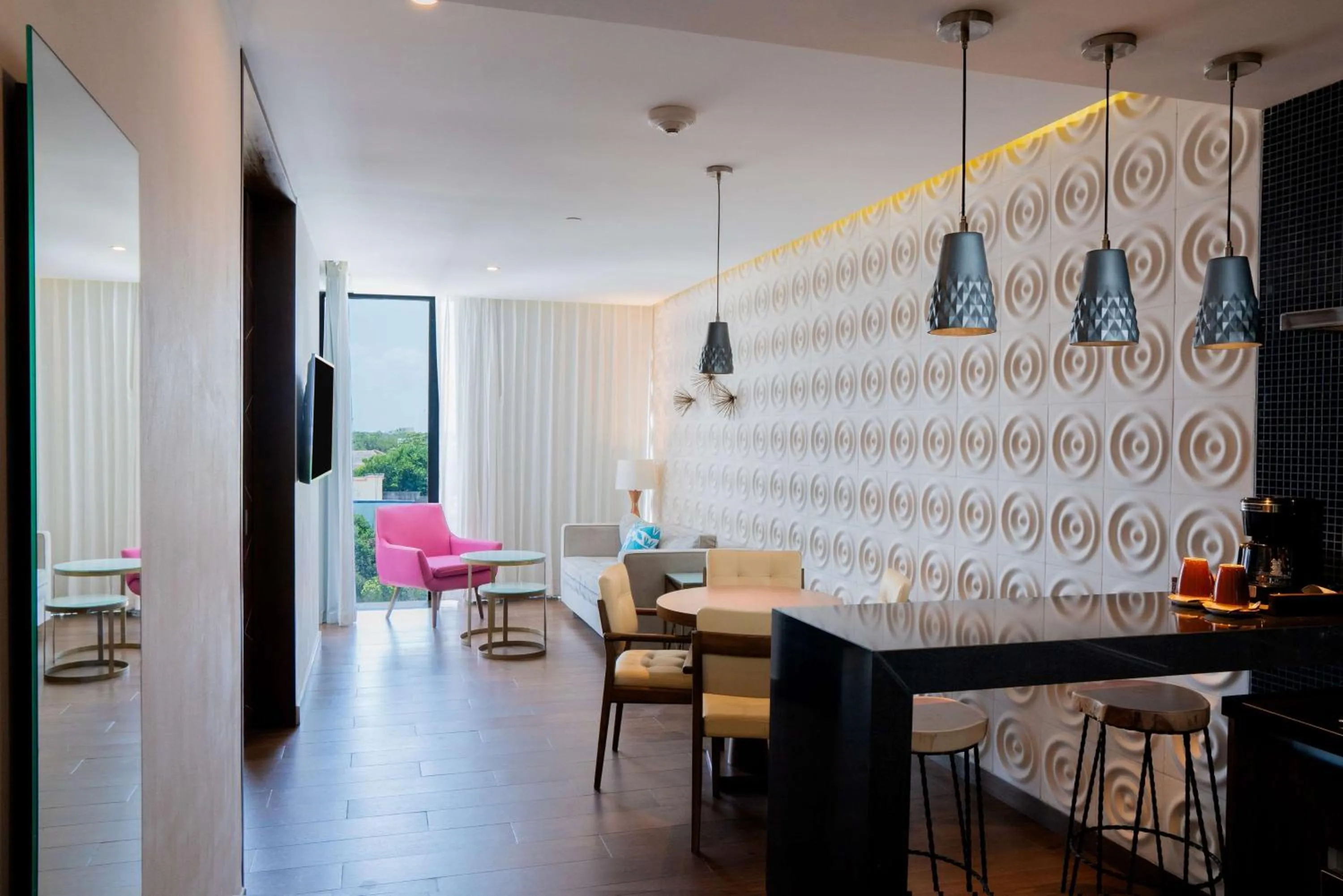 Living room in The Fives Downtown Hotel & Residences, Curio Collection by Hilton