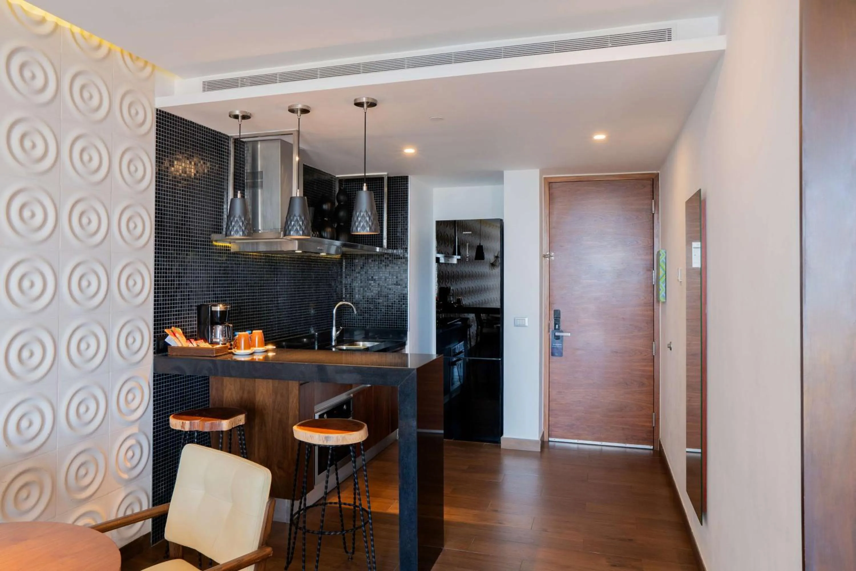 Kitchen or kitchenette in The Fives Downtown Hotel & Residences, Curio Collection by Hilton