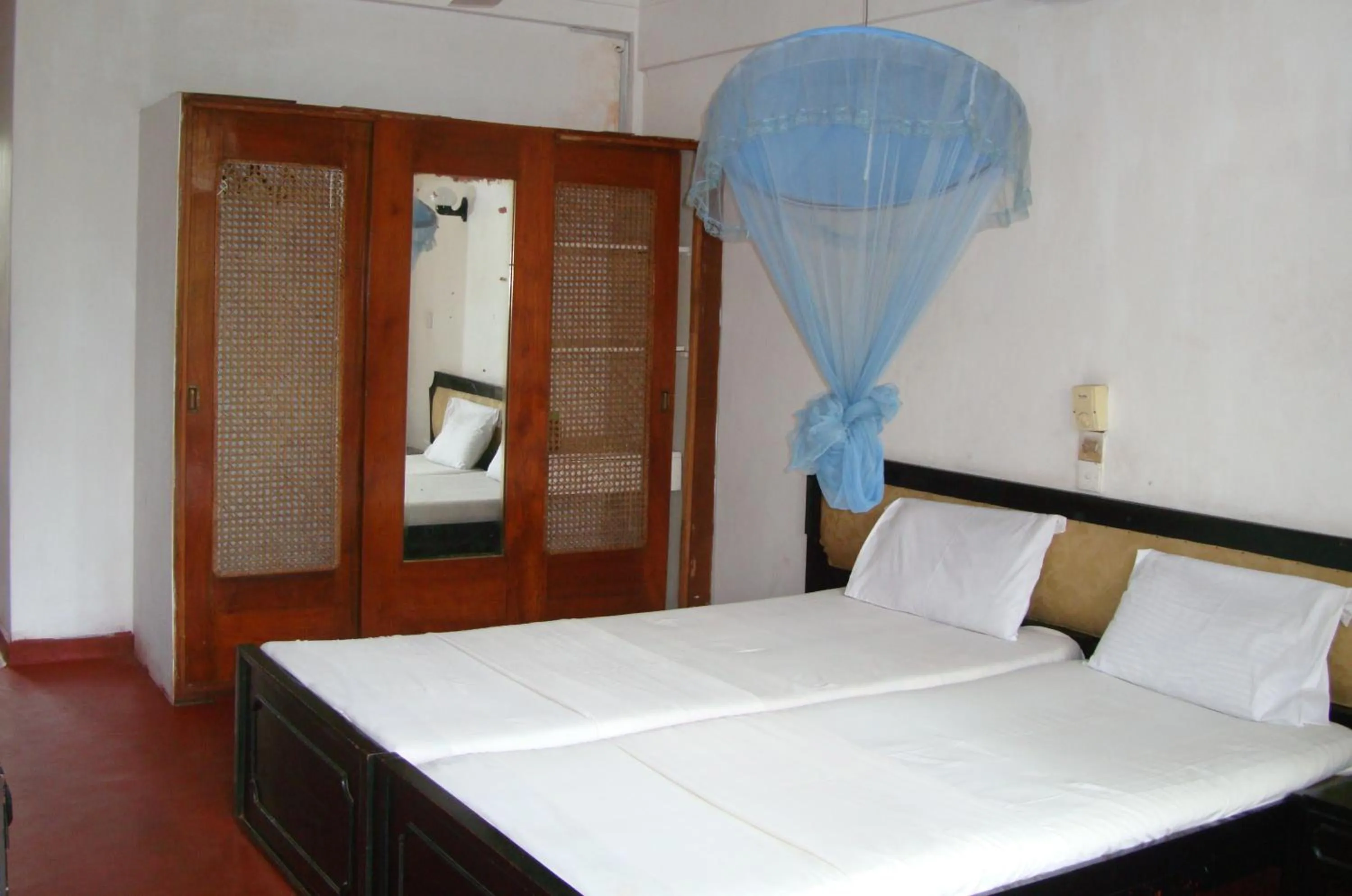 Bed in Topaz Beach Hotel