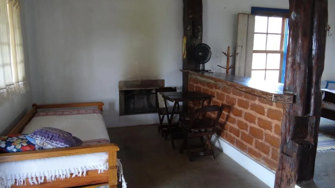 Living room, Bed in Pousada Chalé Terra Viva
